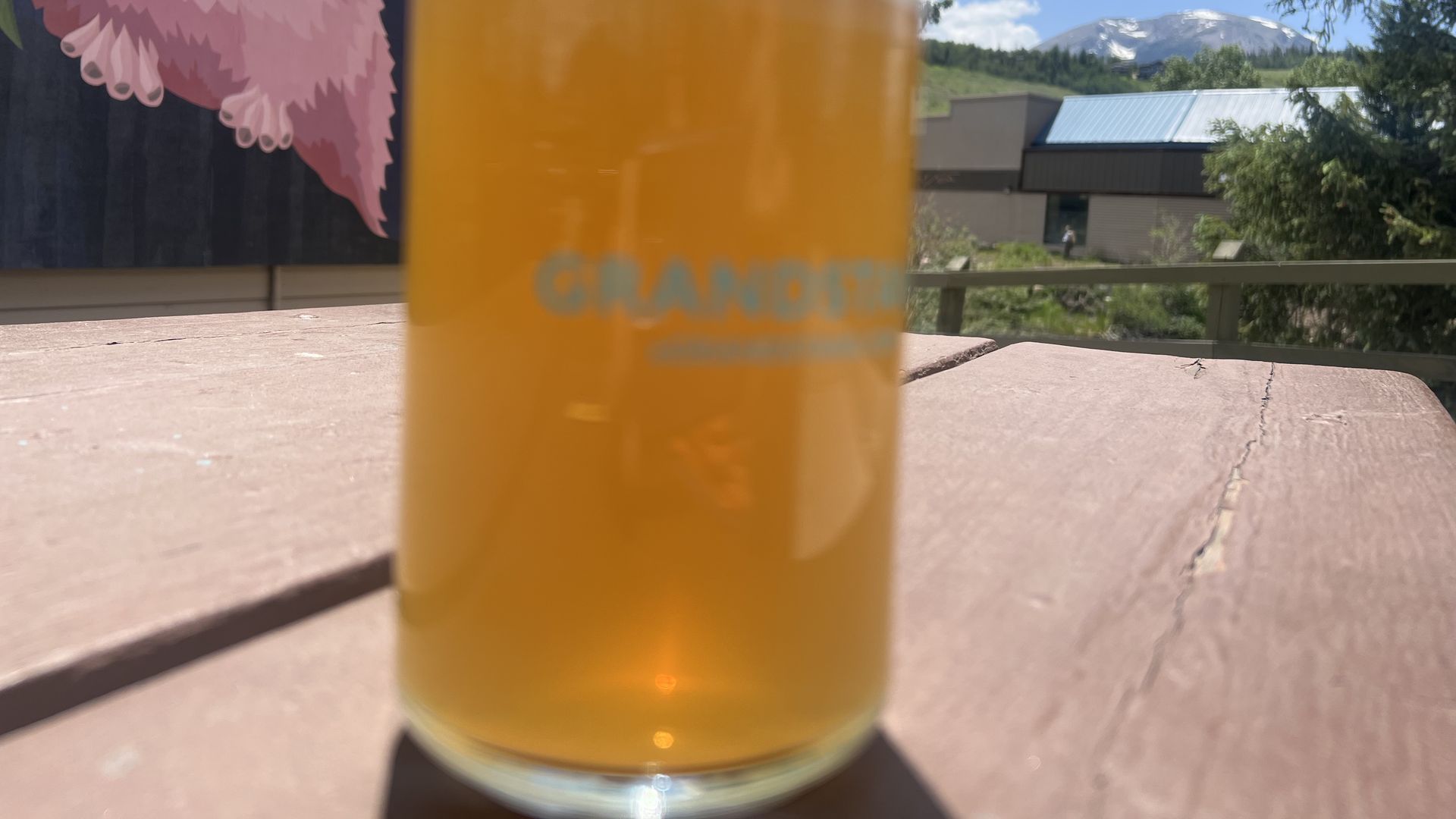 Thirsty Pika Taproom outdoor picnic table with beer