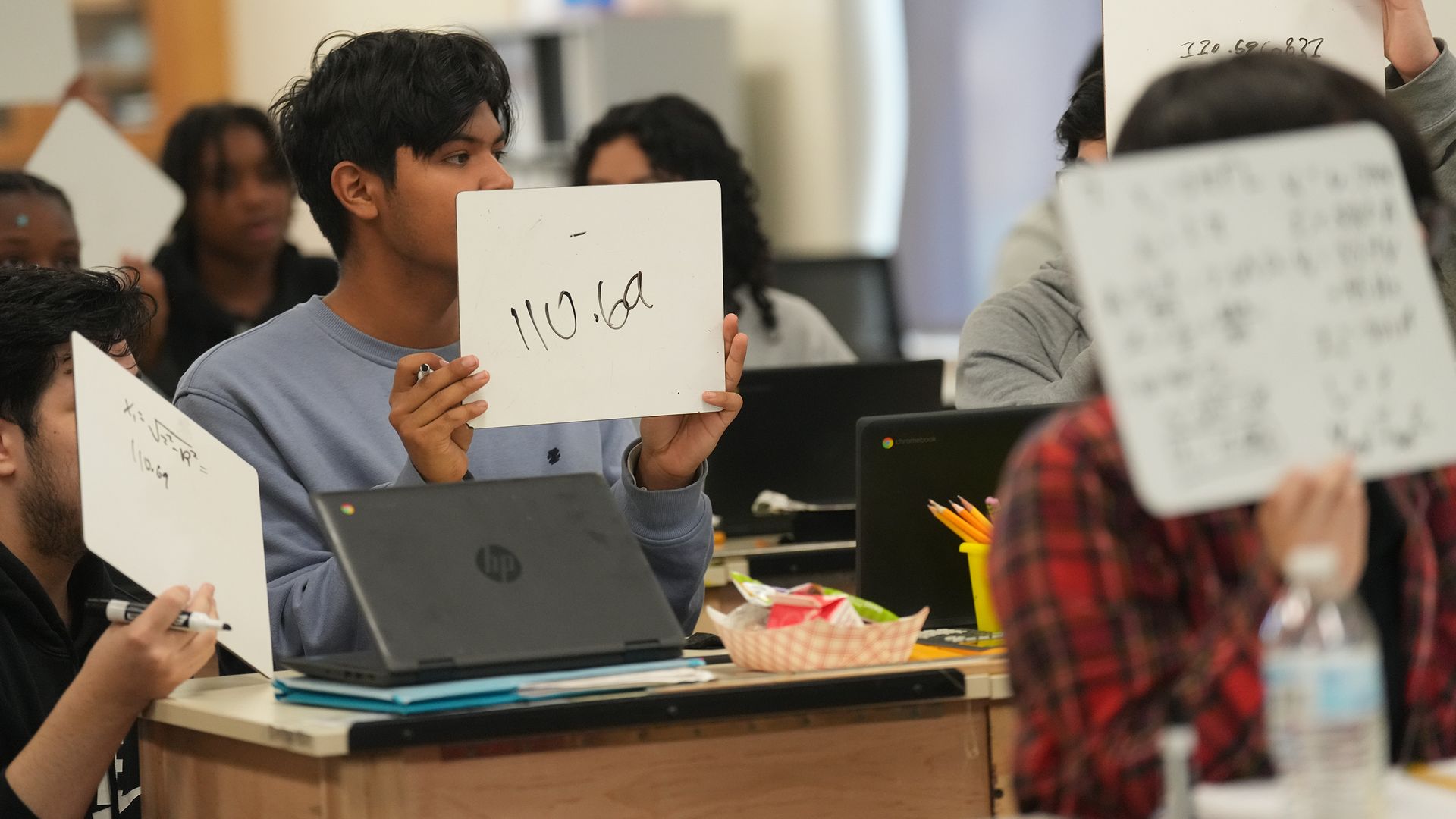  Sharpstown High School students hold up their answers during an OnRamps Physics class on Friday, Jan. 31, 2025 in Houston. Photo: Elizabeth Conley/Houston Chronicle via Getty Images