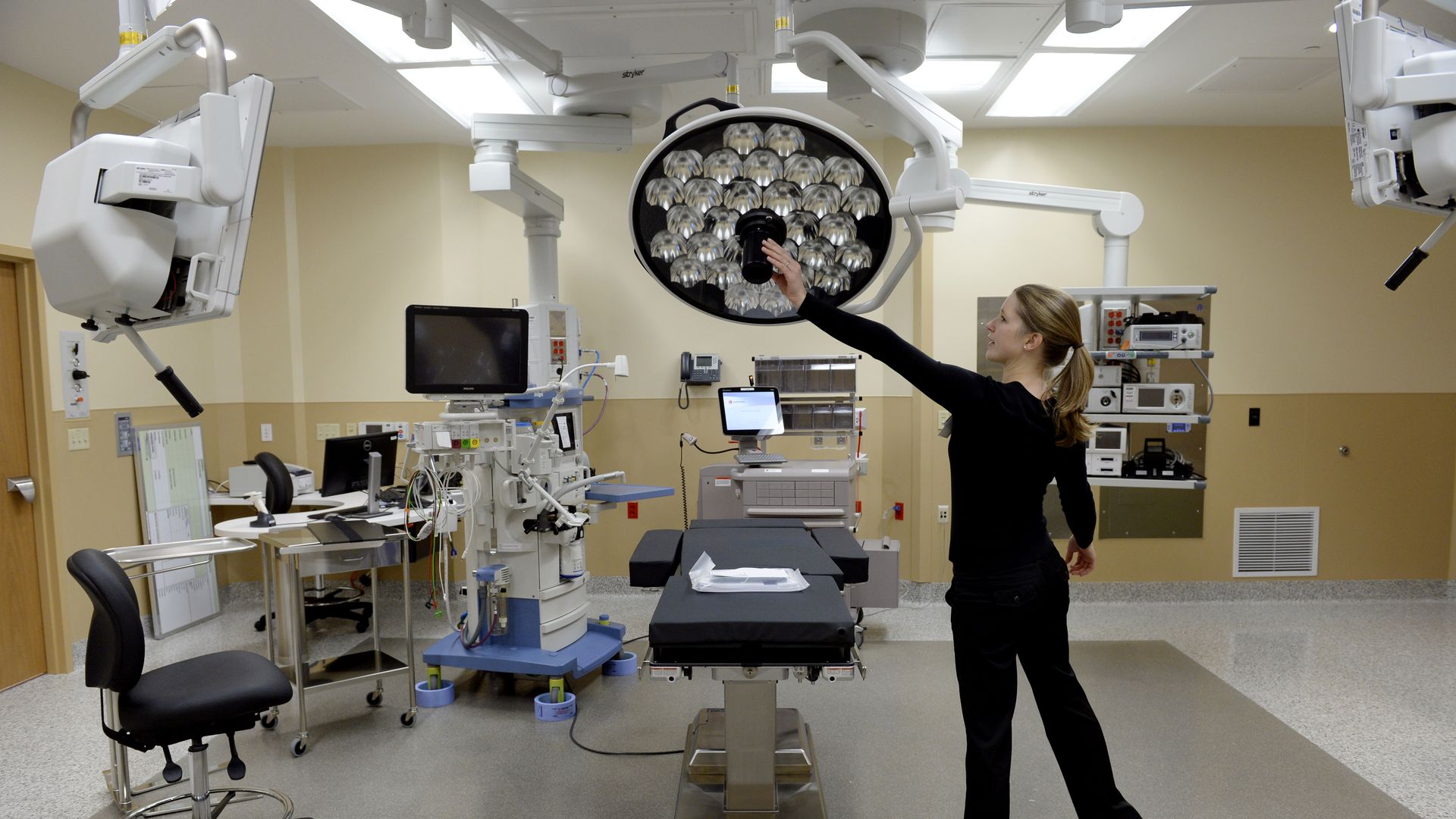 A nurse manager sets up a hospital's operating room.