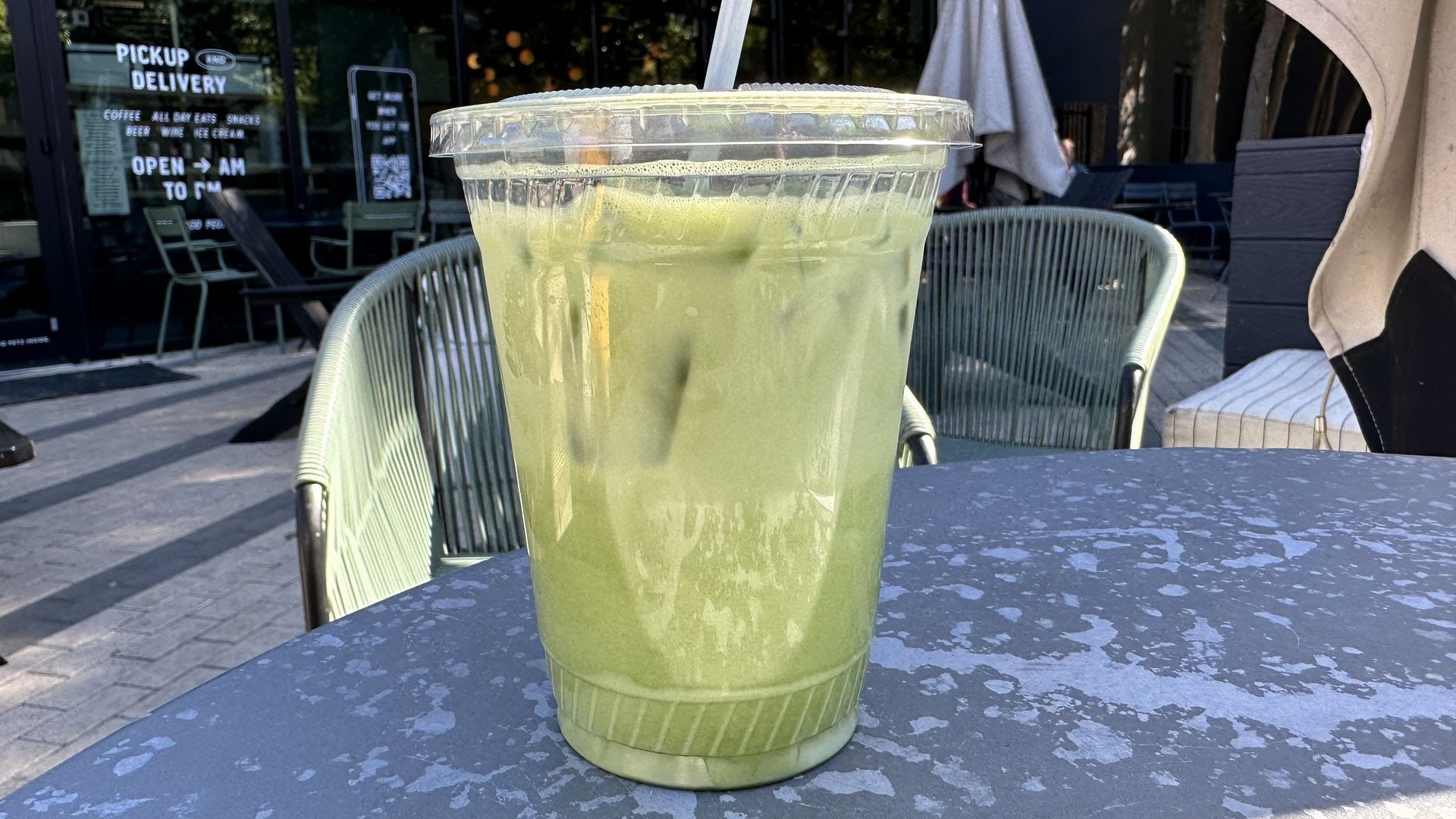 An iced matcha latte on a table