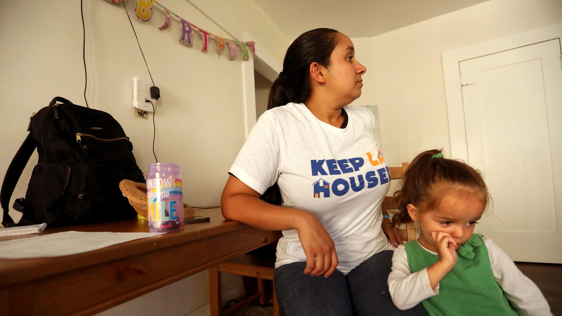 Heidi Gonzalez, 32, and her daughter Sarita, 2, sit in the living room of their apartment in Los Angeles' Koreatown on September 27, 2022.