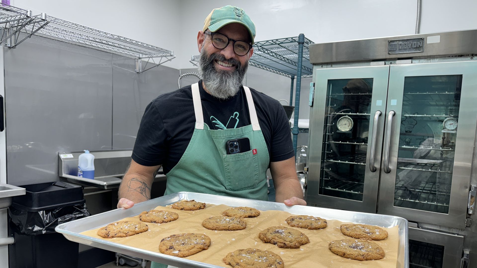 man holding cookie tray