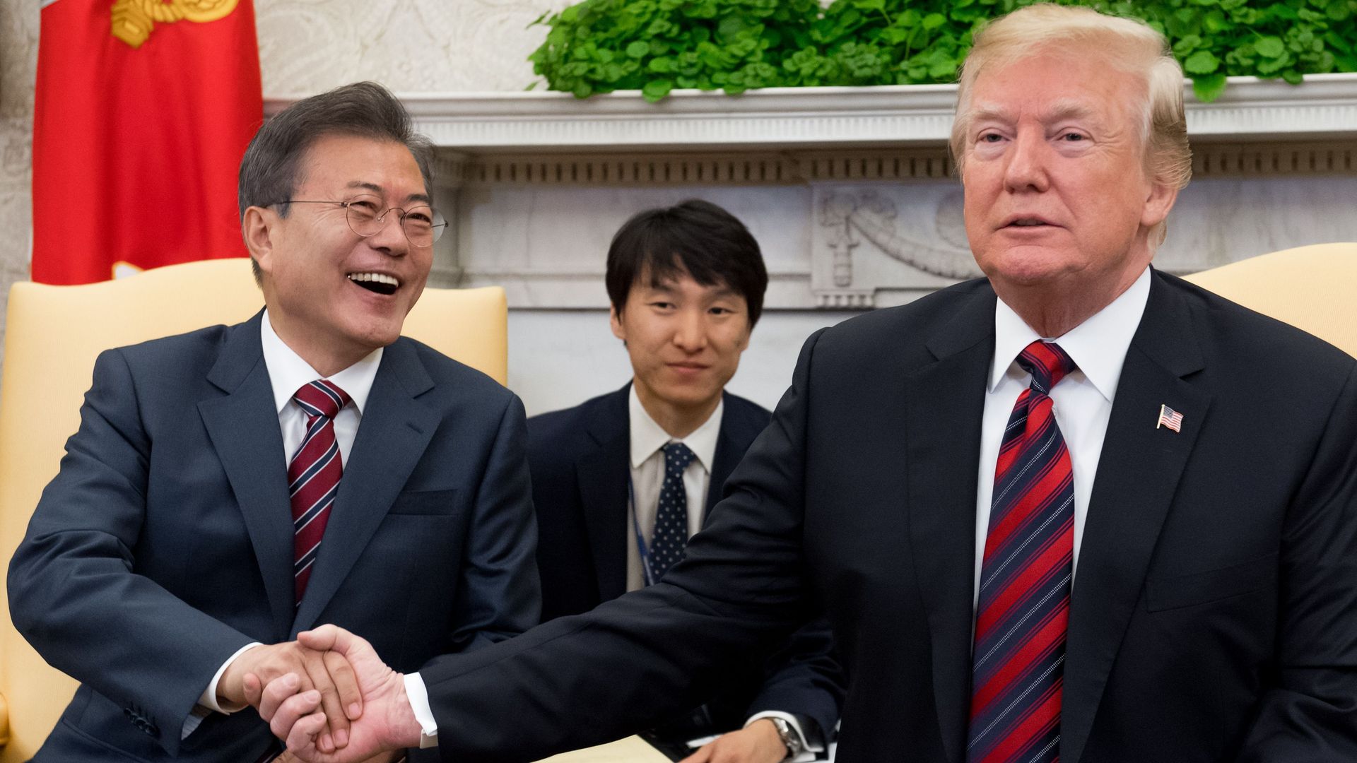 Presidents Moon Jae-in and Donald Trump shake hands at White House