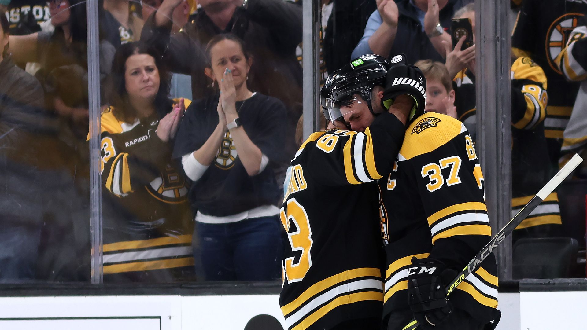 bruins teammates consoling each other