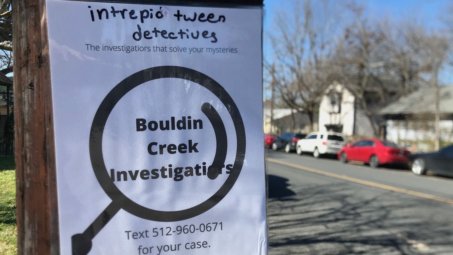 A flyer posted to a telephone pole about private investigators.