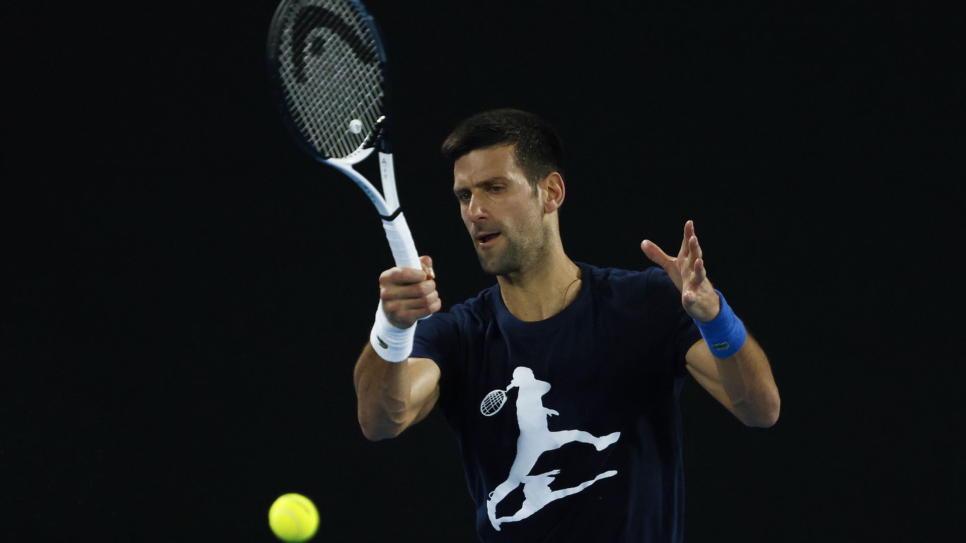 Novak Djokovic of Serbia plays a forehand during a practice session ahead of the 2022 Australian Open at Melbourne Park on January 14, 2022