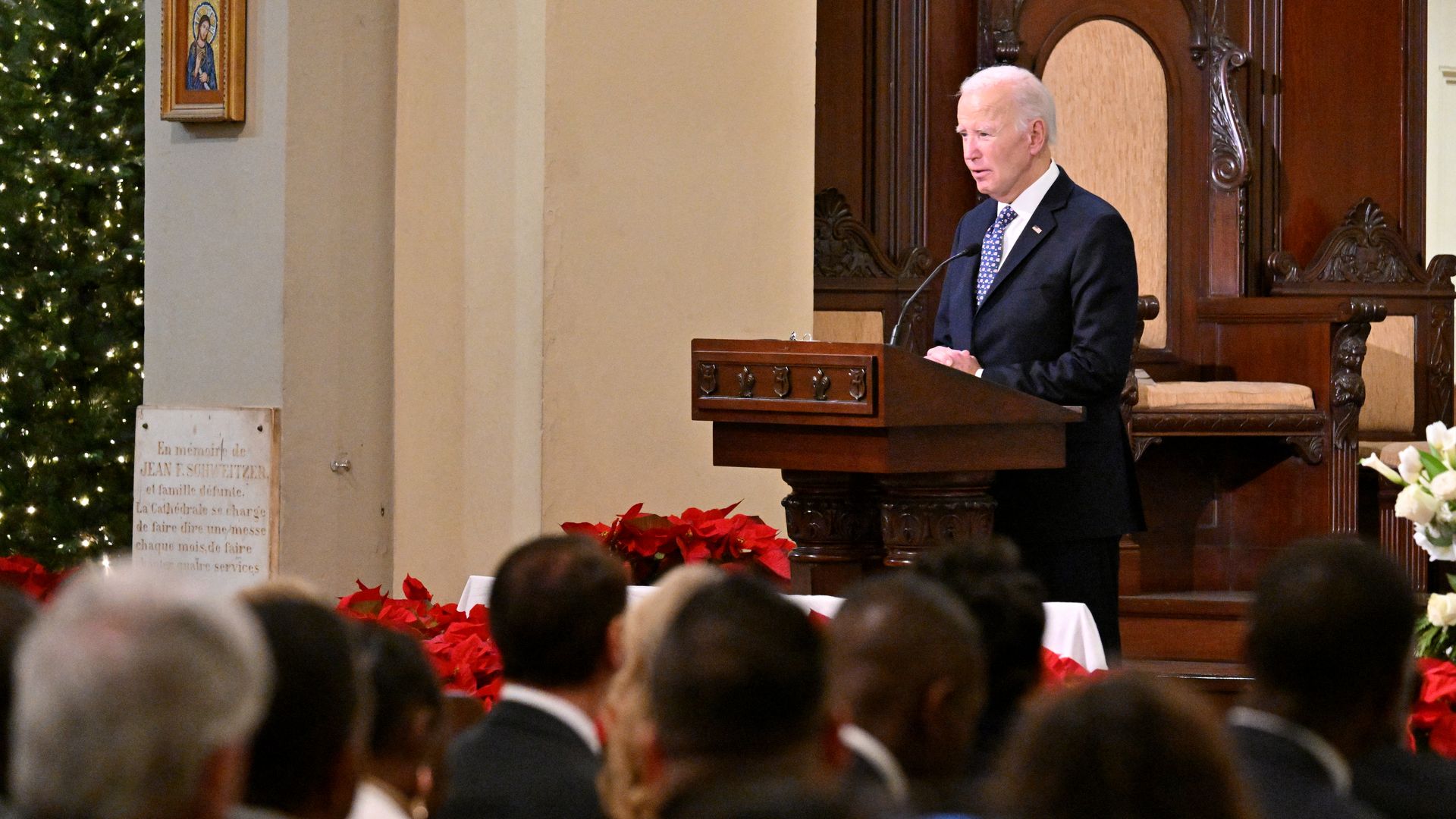 Photo shows Joe Biden standing a lectern.