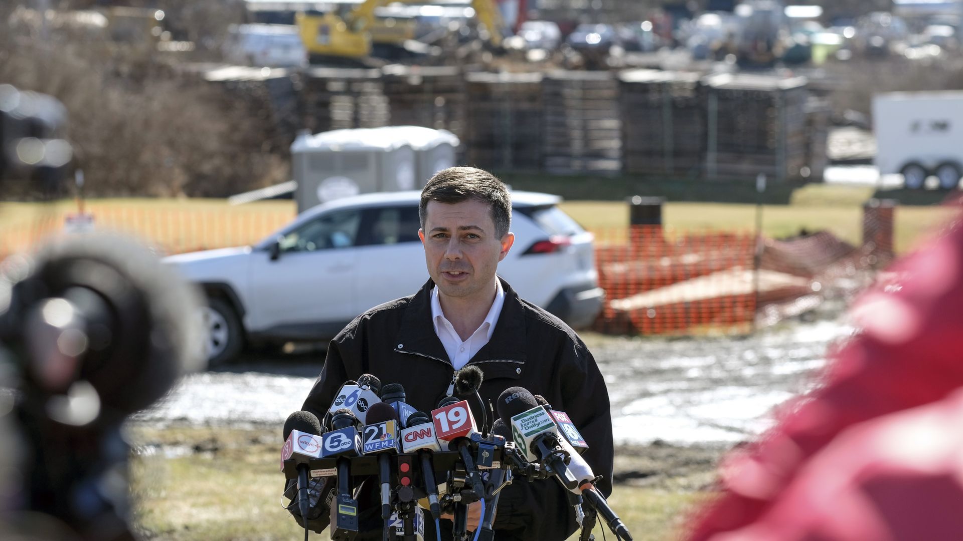Pete Buttigieg, US transportation secretary, center right, speaks during a news conference near the site of the Norfolk Southern train derailment in East Palestine, Ohio, US, on Thursday, Feb. 23.