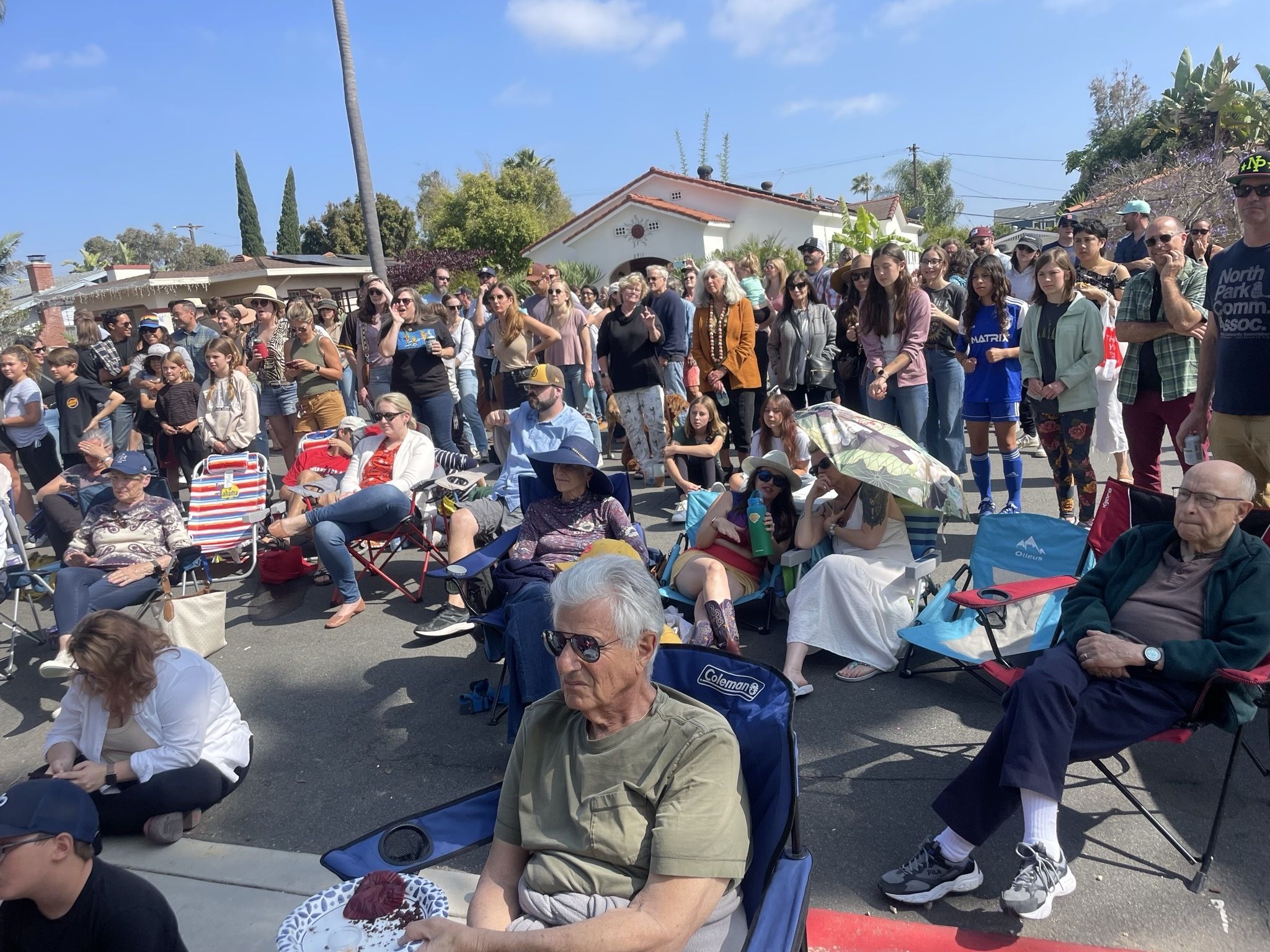 A crowd watches musicians in the street