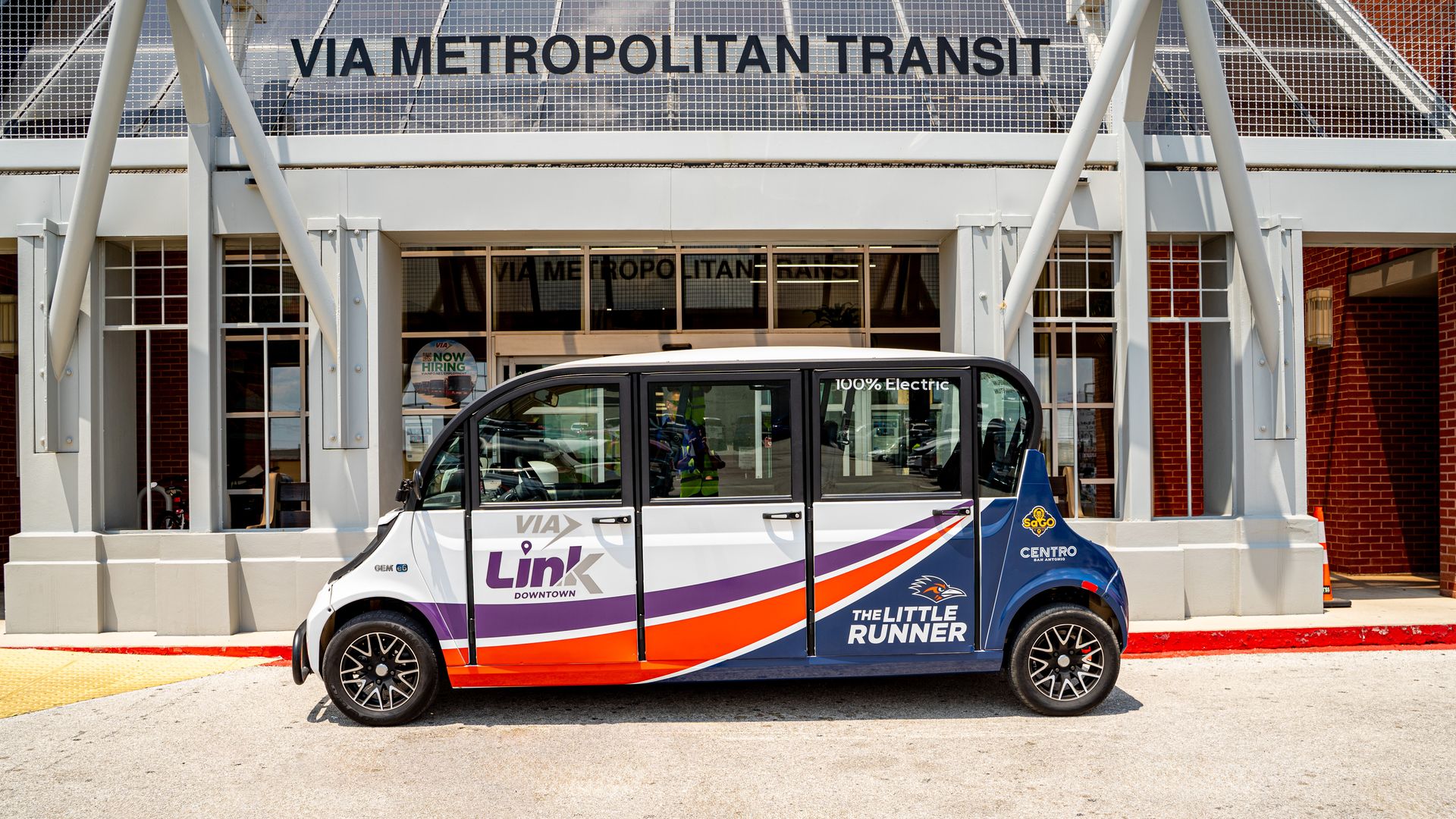 A small shuttle branded with VIA Link and The Little Runner.