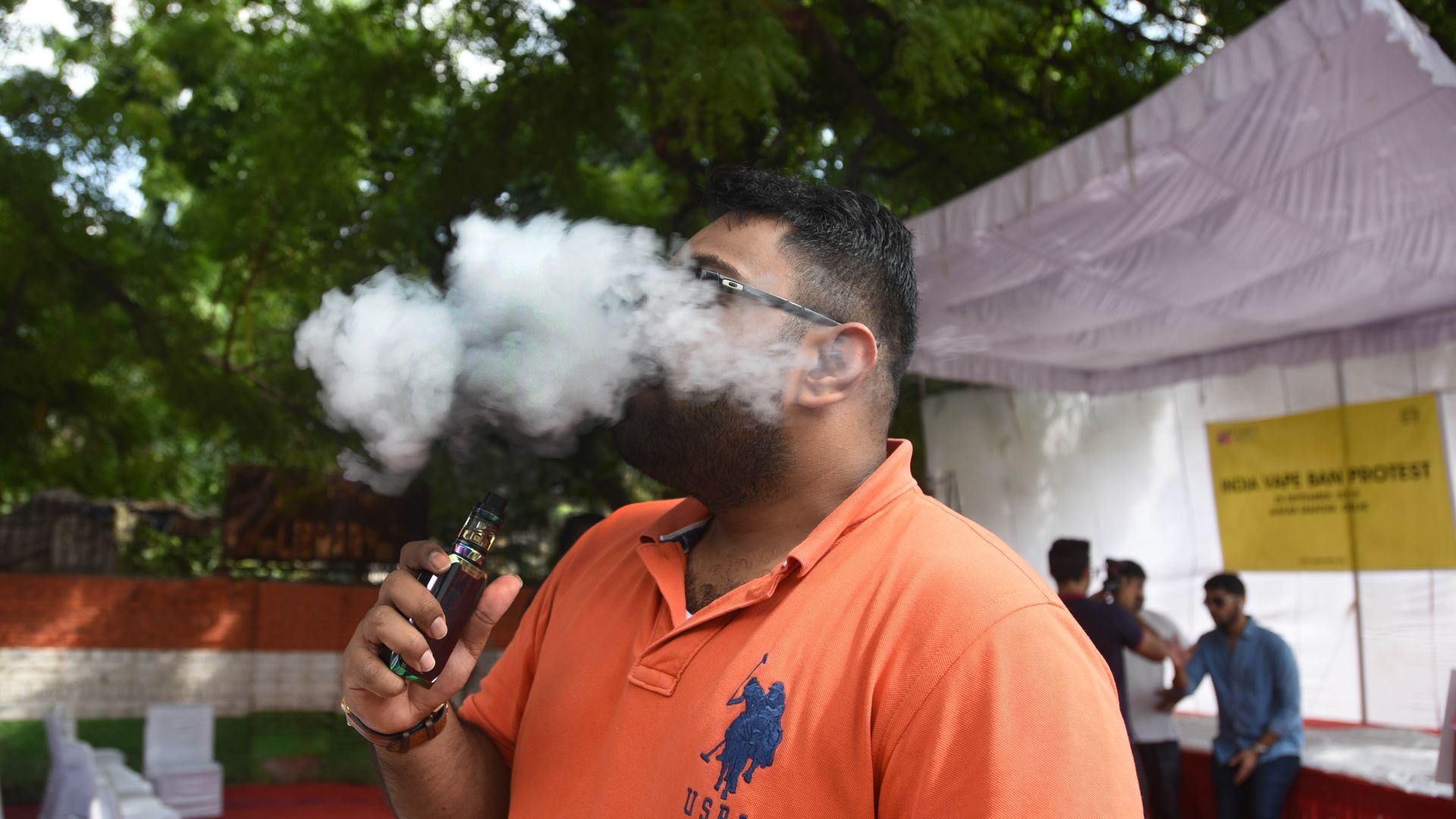 A man vapes.