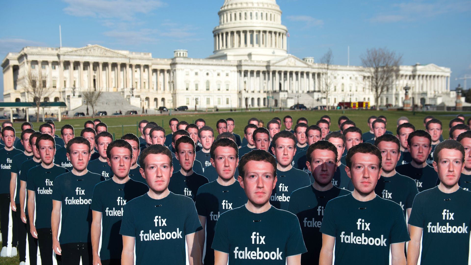 ne hundred cardboard cutouts of Facebook founder and CEO Mark Zuckerberg stand outside the US Capitol 