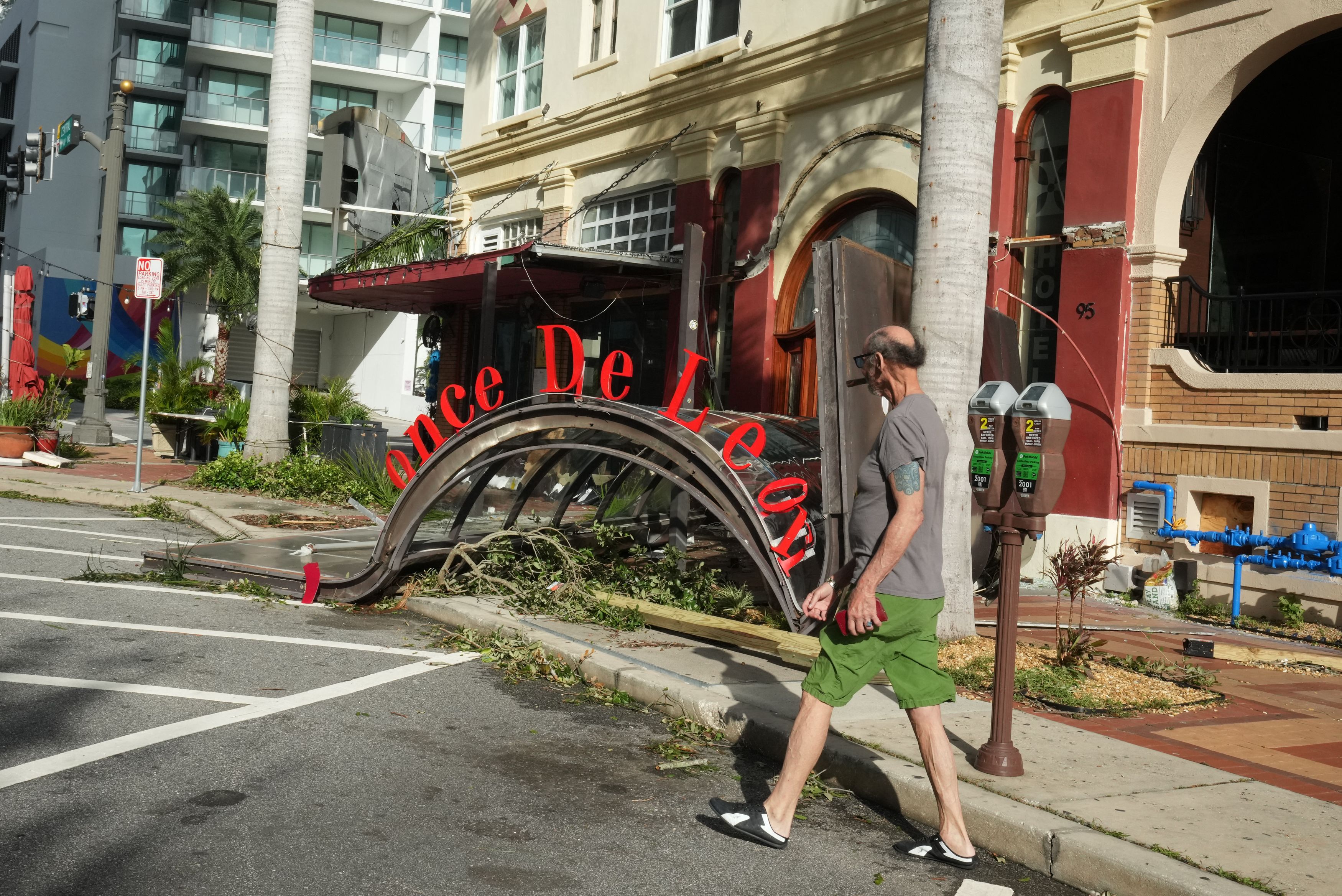 The awning of a restaurant has collapsed on the sidewalk in St. Petersburg due to Hurricane Milton on October 10, 2024 in Florida. At least four people were confirmed killed as a result of two tornadoes triggered by Hurricane Milton on the east coast of the US state of Florida, local authorities sai