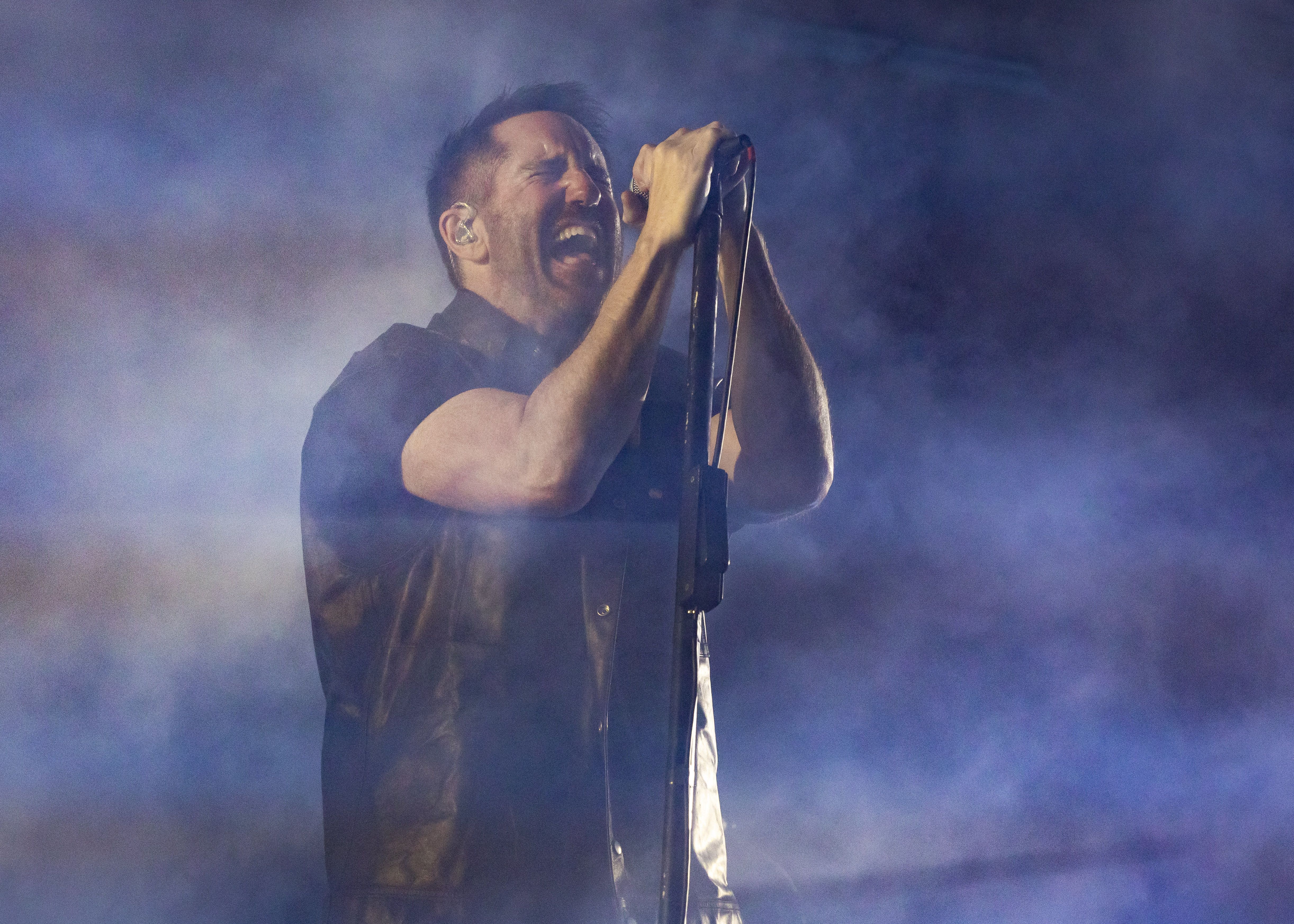 Trent Reznor of Nine Inch Nails performs on stage. 