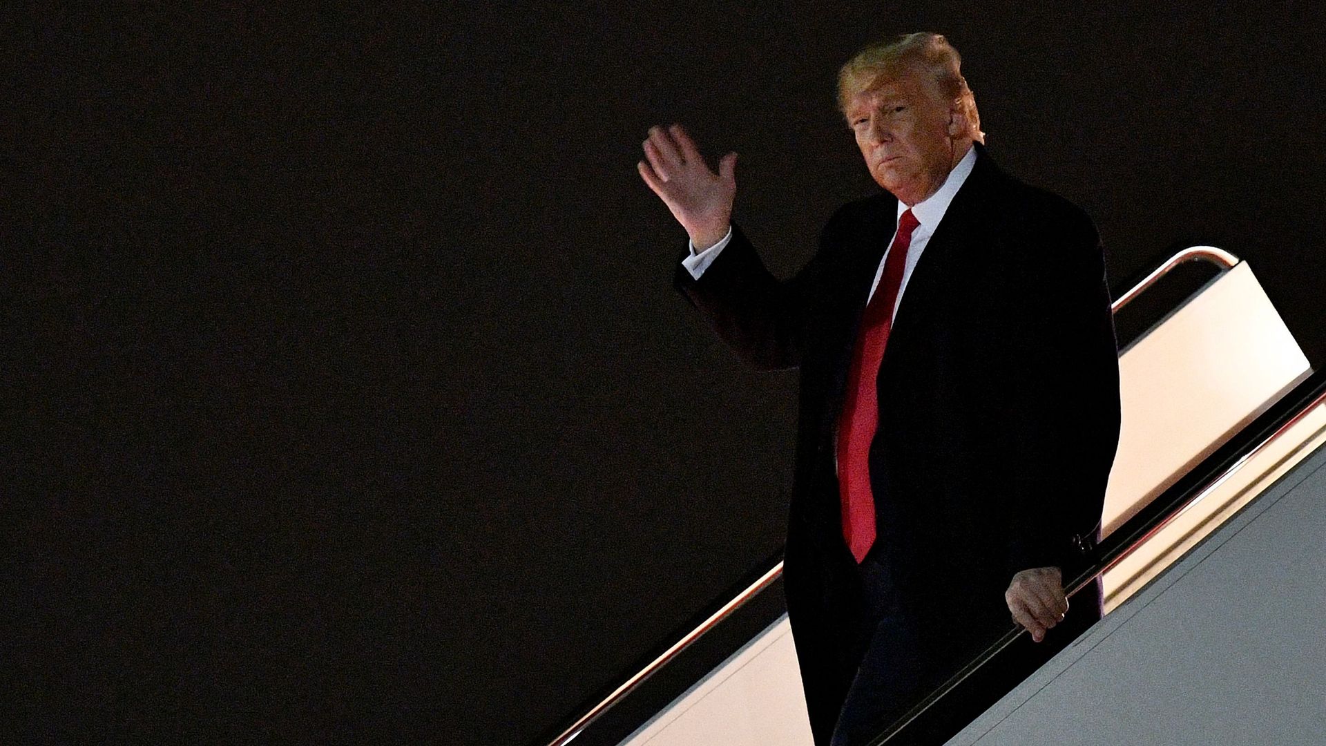 Trump coming off his plane.