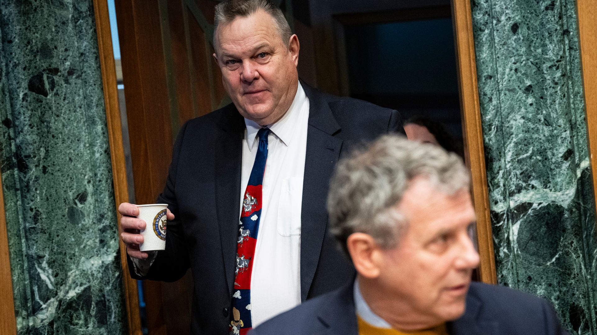 Senator Jon Tester, a Democrat from Montana, left, arrives for a Senate Banking, Housing, and Urban Affairs Committee hearing in Washington, DC, US, on Thursday, Jan. 11, 2024.