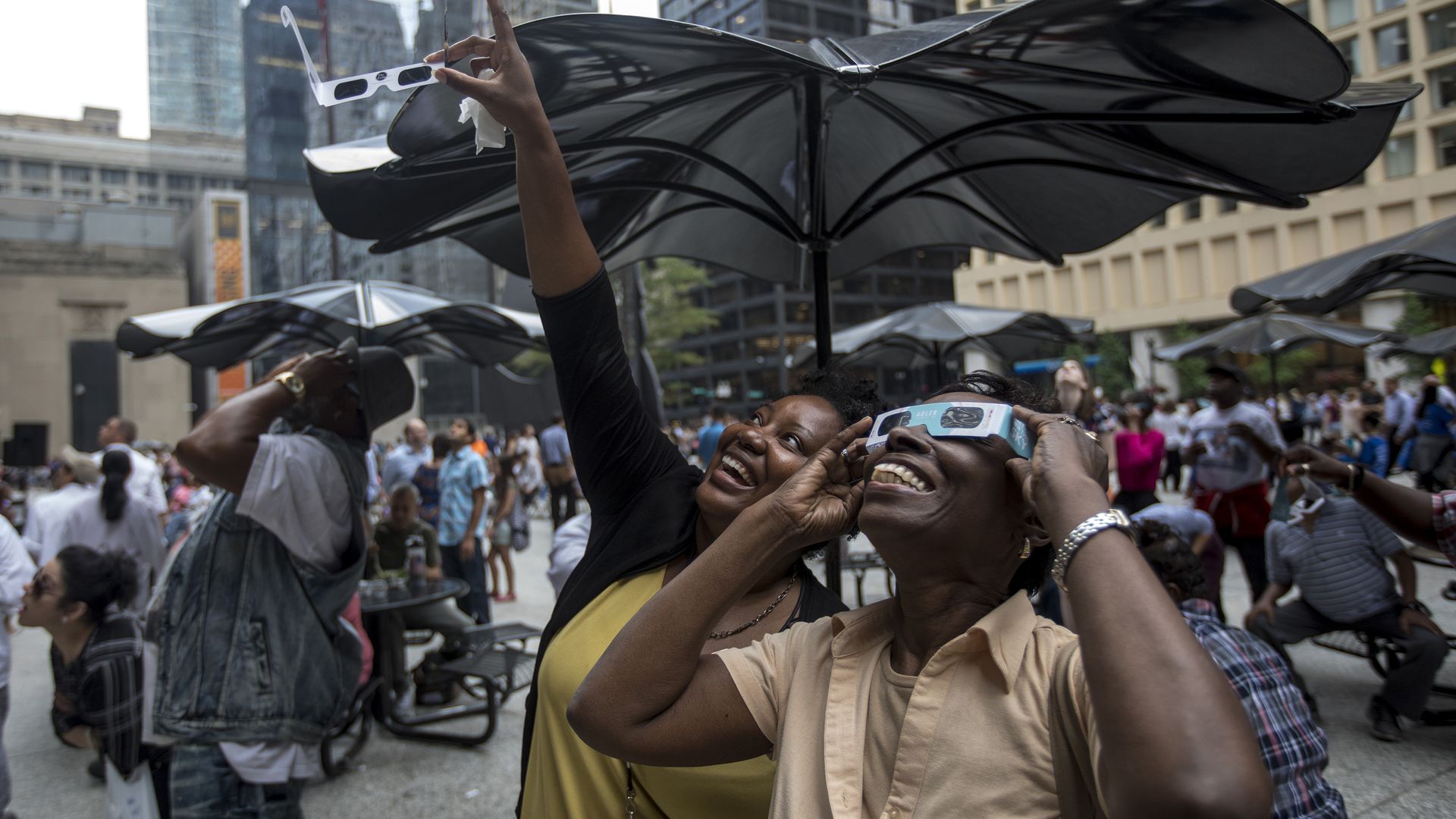 Photo of people staring and pointing to the sky