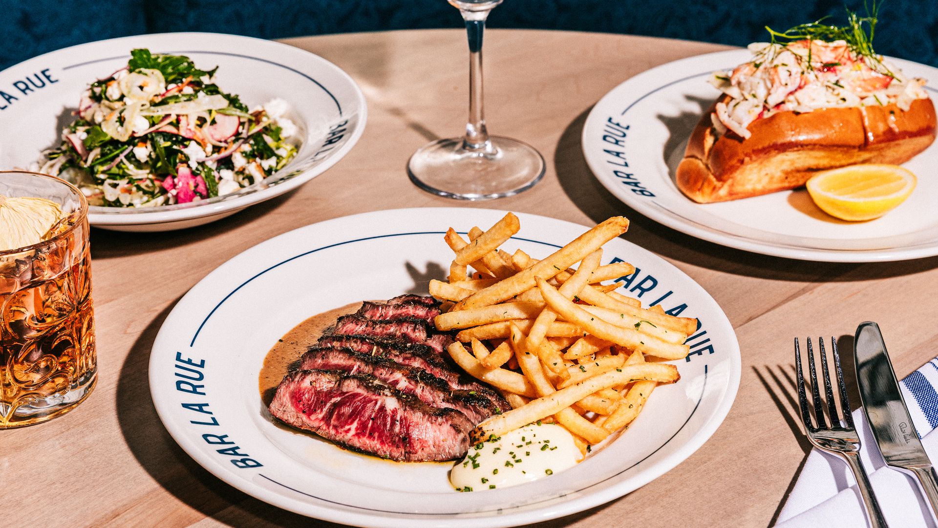 Photo of three plates of food on a table. 