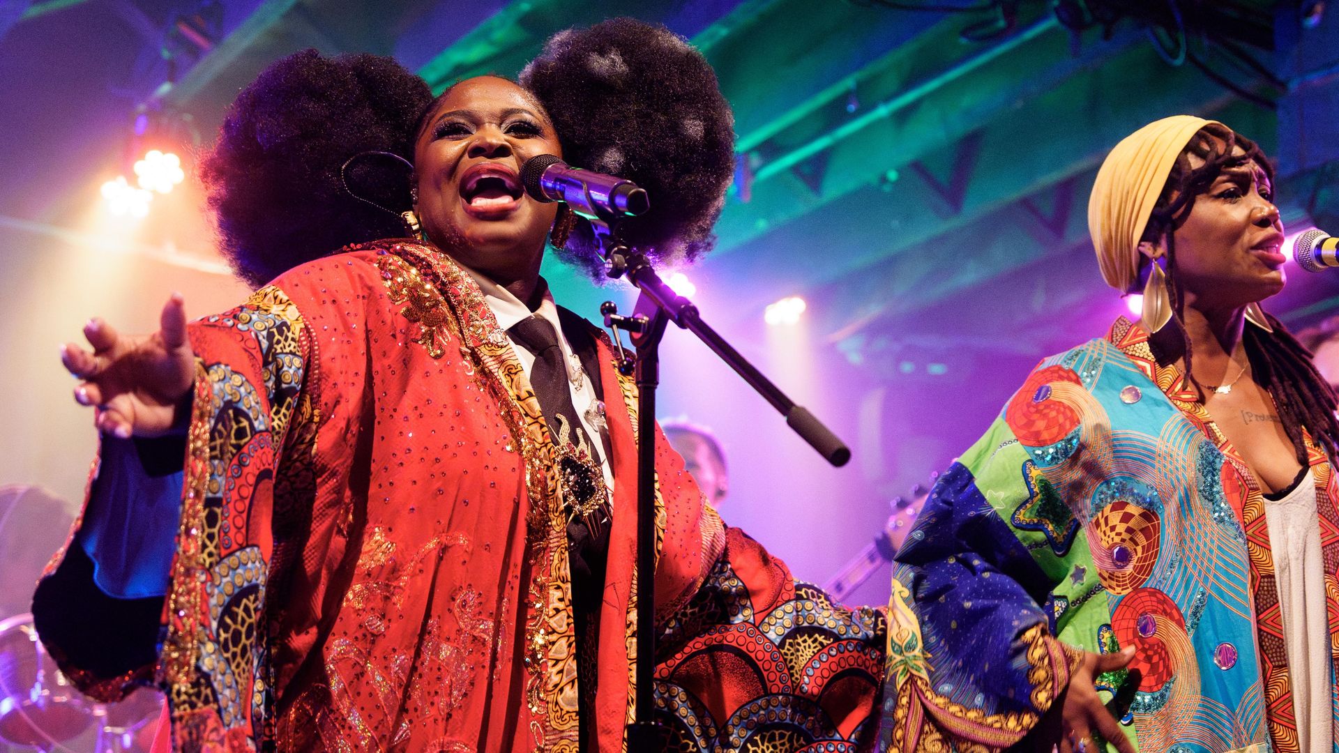 Photo shows Tarriona "Tank" Ball of Tank and the Bangas singing on stage.