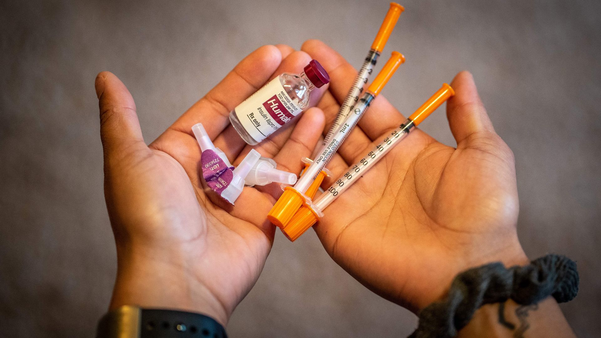 Someone holding insulin