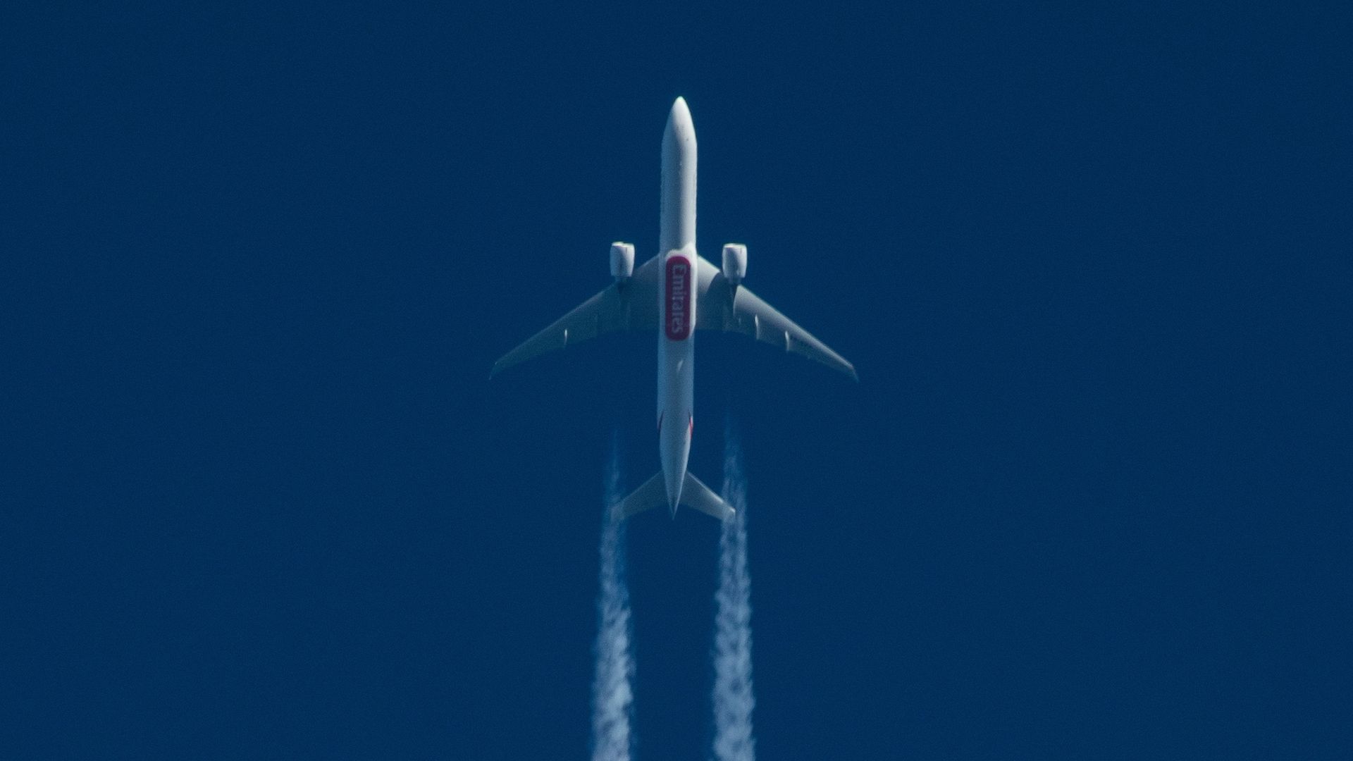 A Boeing 777 of Emirates Airlines pictured flying at high altitude.