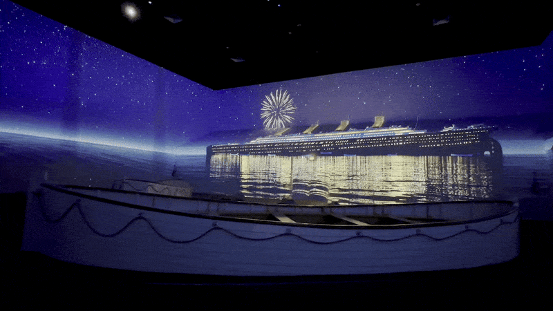 Image shows a lifeboat with emergency flares going off.