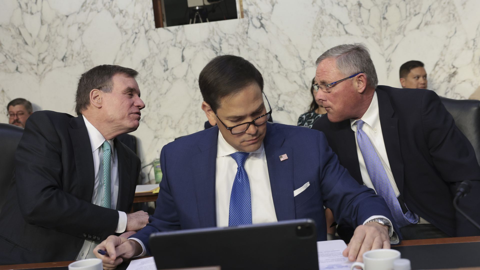Senator Rubio sitting on the committee dais 