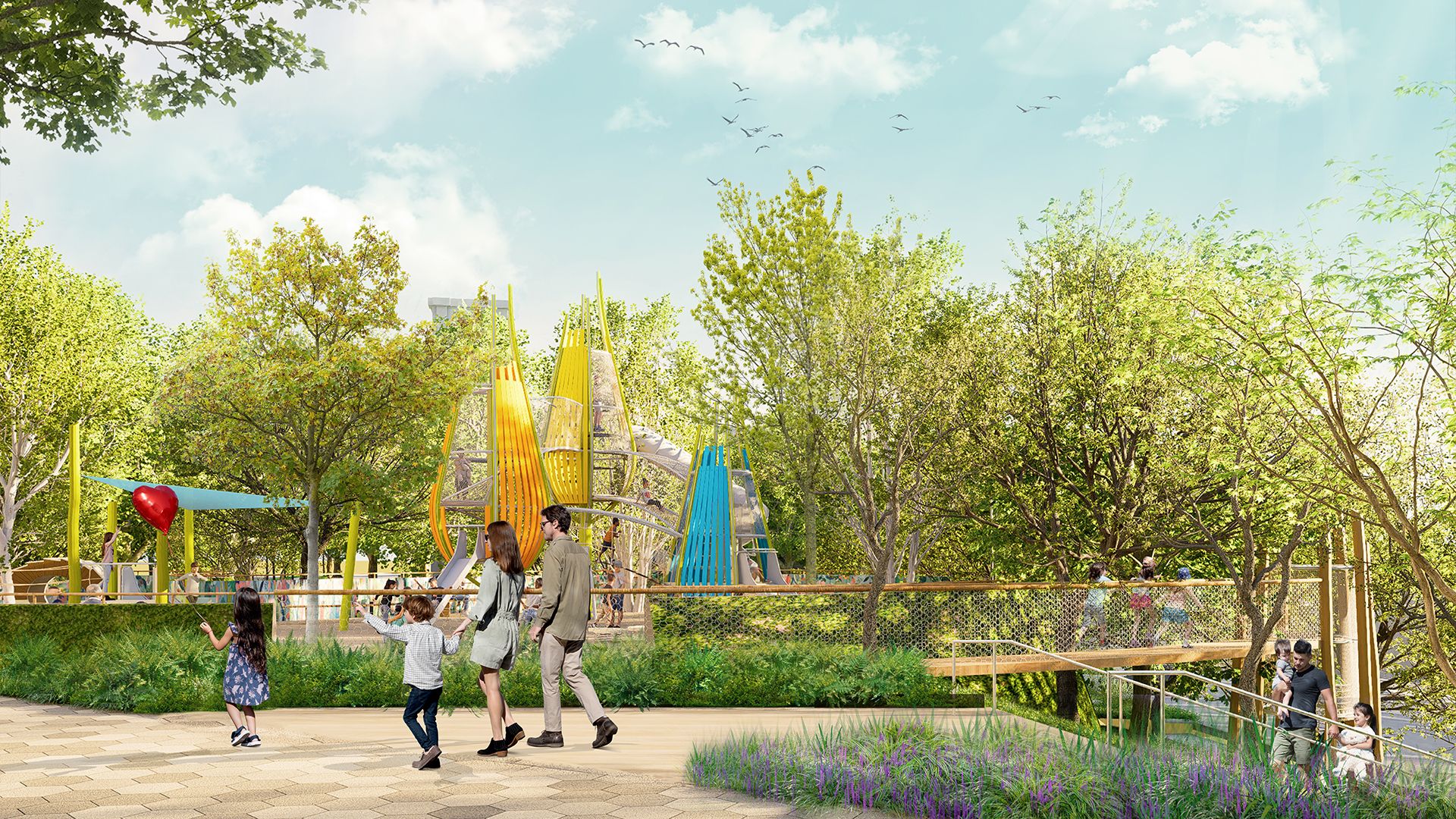 Park scene with families walking near a colorful playground structure featuring yellow and blue slides, surrounded by green trees under a partly cloudy sky with birds flying.