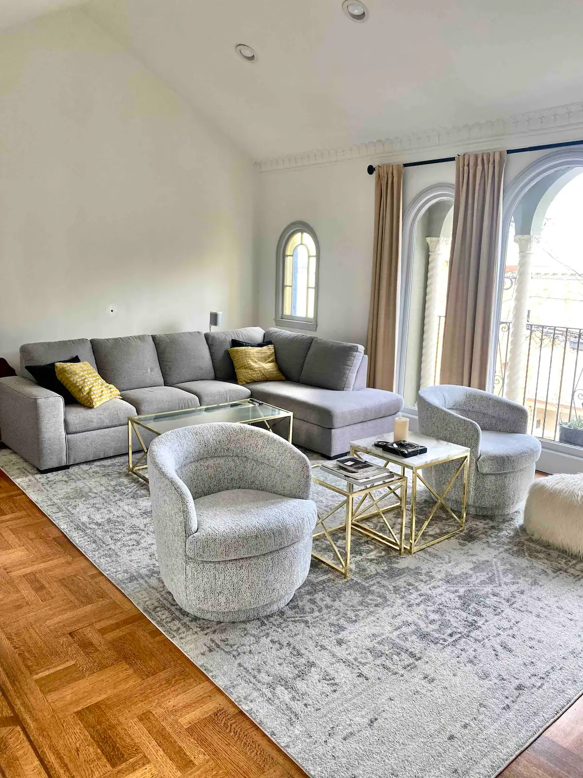 living room with accent chairs and sectional
