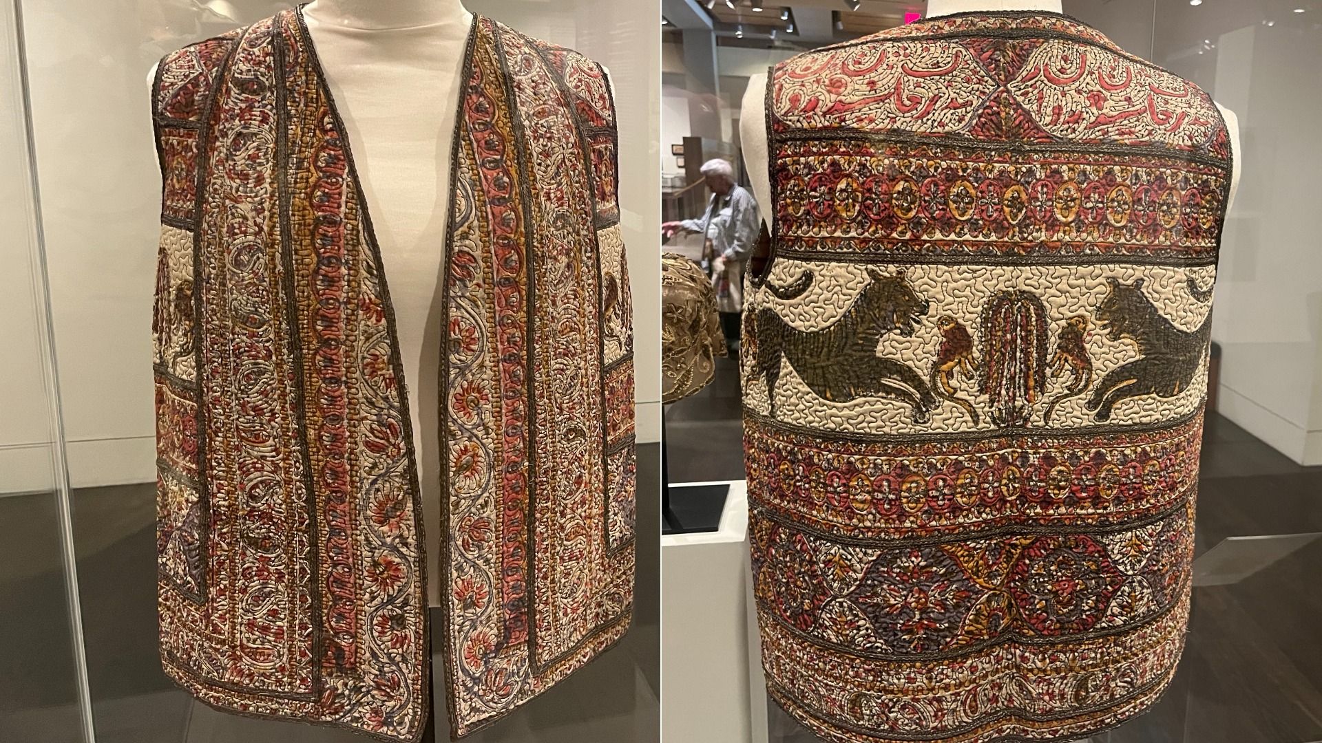 Two-panel display of a quilted sleeveless vest in red, cream, and gold. Left shows the front on a mannequin with vertical patterned panels; right shows the back with horses and decorative bands.
