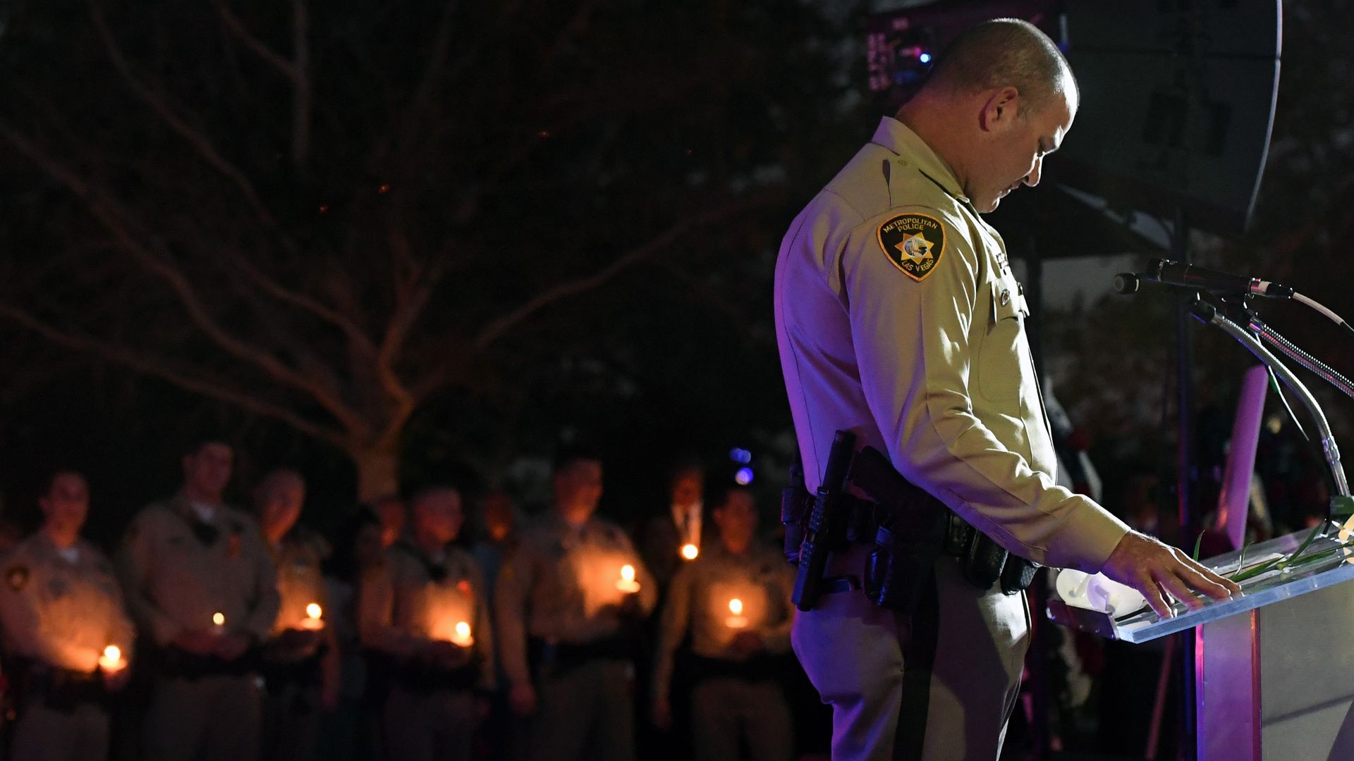 A Las Vegas police officer speaks at a vigil for the victims of the Las Vegas shooting.