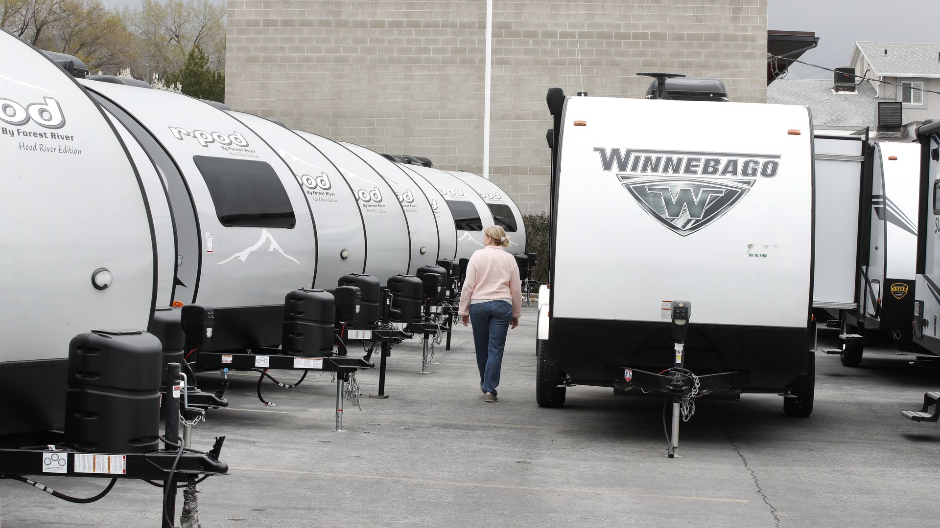 New travel trailers in a parking lot.