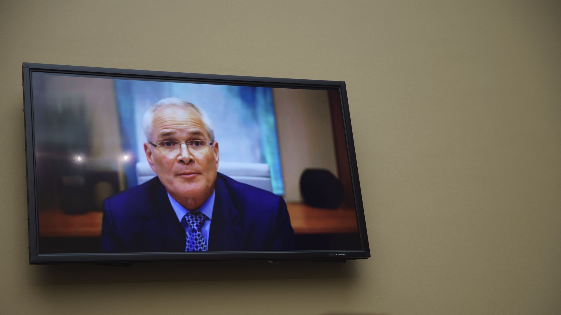 Darren Woods, chairman and CEO of ExxonMobil, speaks via videoconference during a House committee hearing on Oct. 28, 2021.