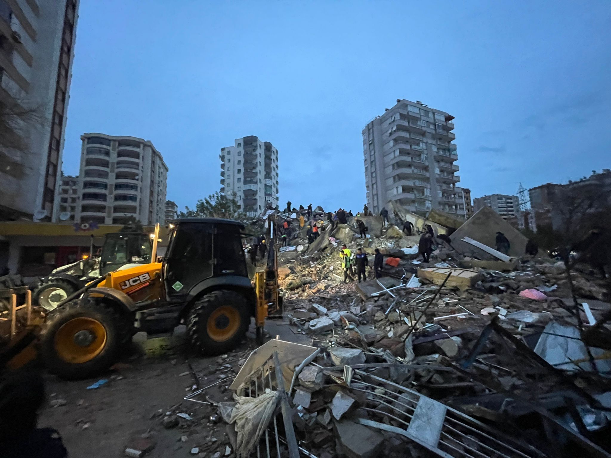 A  destroyed apartment and damaged vehicle in Yurt neighborhood of Cukurova district after the earthquake on February 6, 2023 in Adana, Turkiye.