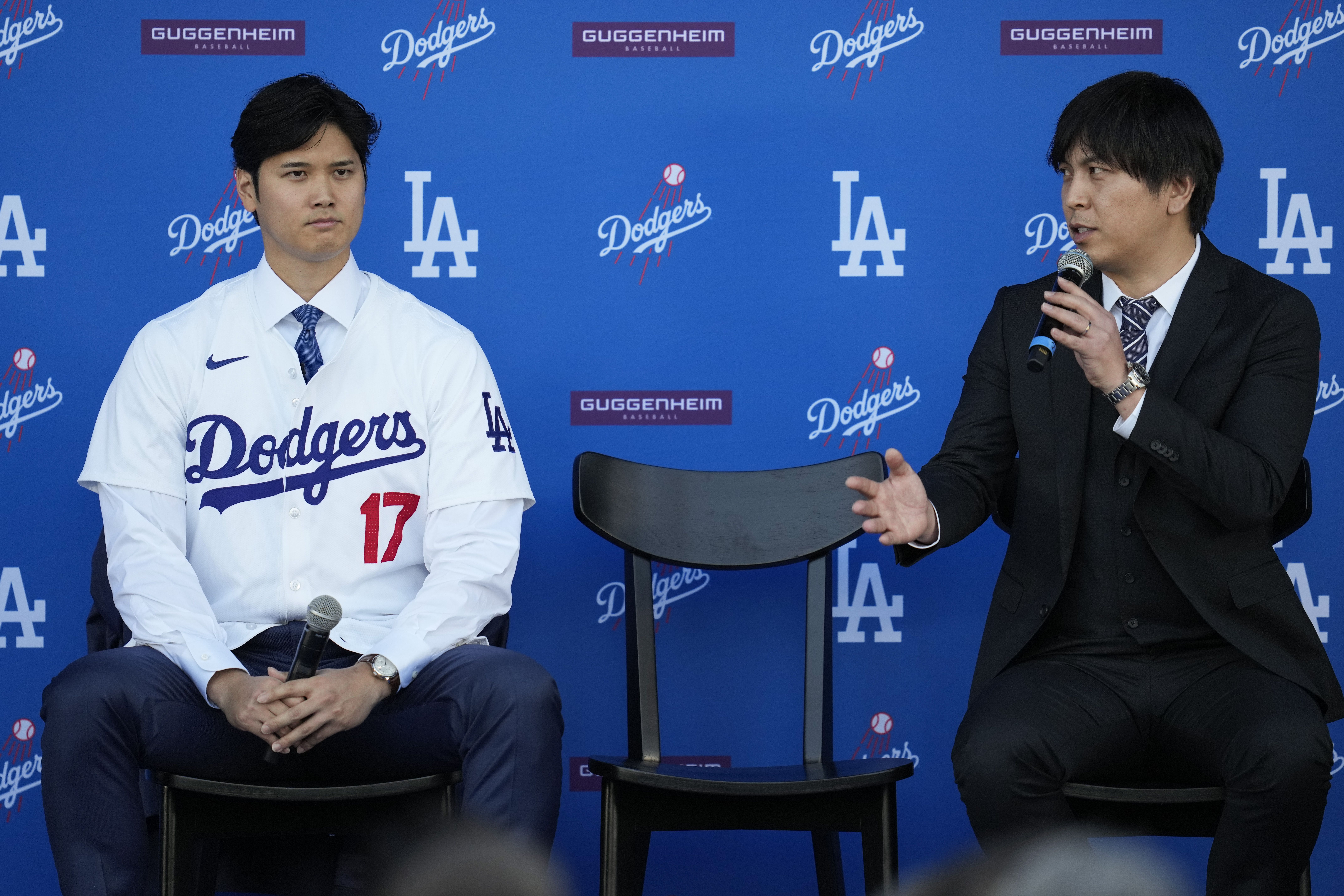 Shohei Ohtani and former interpreter Ippei Mizuhara answer questions during a press conference at Dodger Stadium last year.