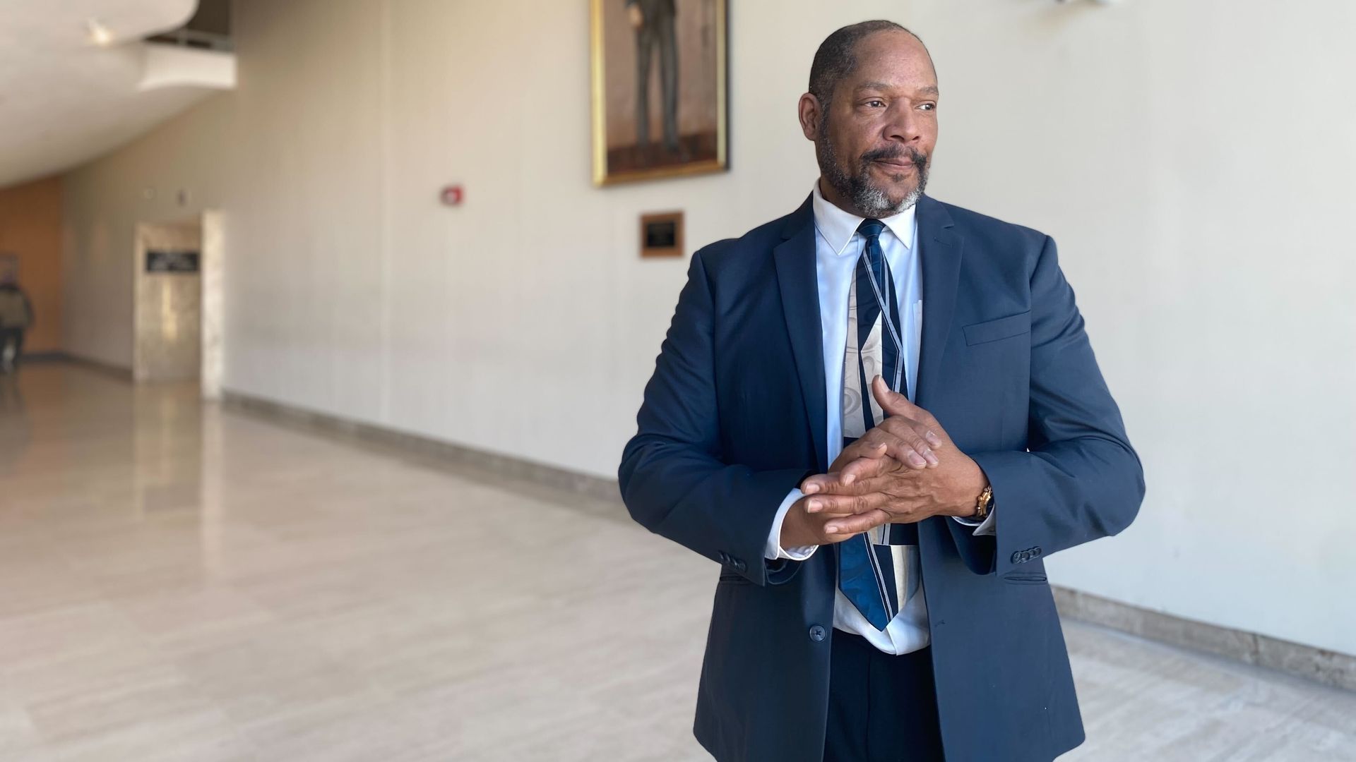 Michael Robinson, Lula Belle Stewart-Robinson's youngest son, 66, speaks with Axios at city hall.