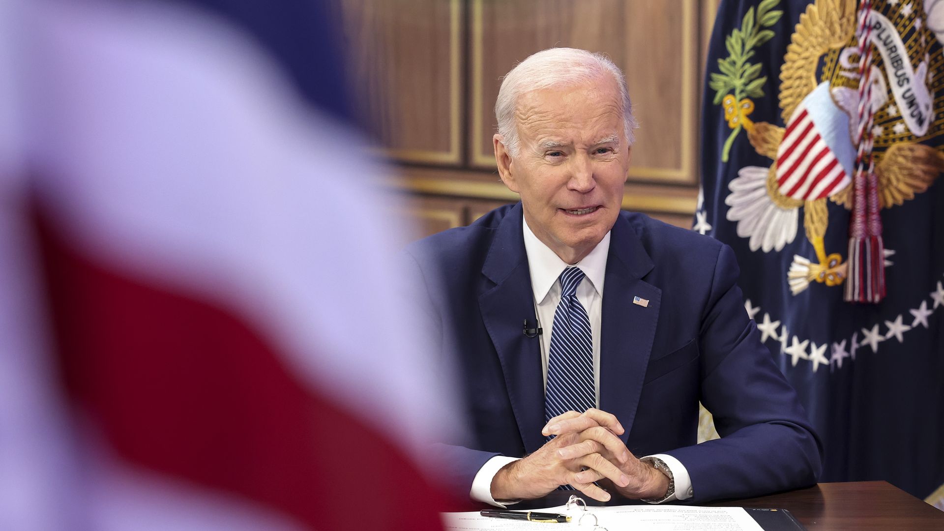 Photo of Joe Biden speaking from a desk