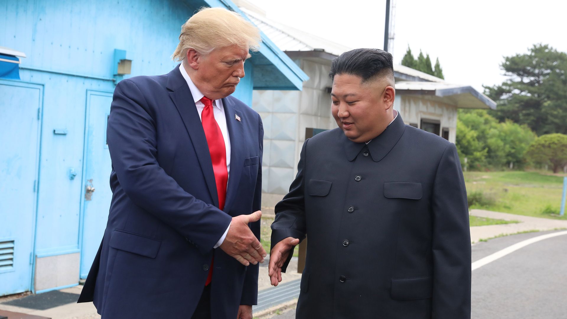 President Trump and North Korean leader Kim Jong-un shake hands at the DMZ in June 2019.