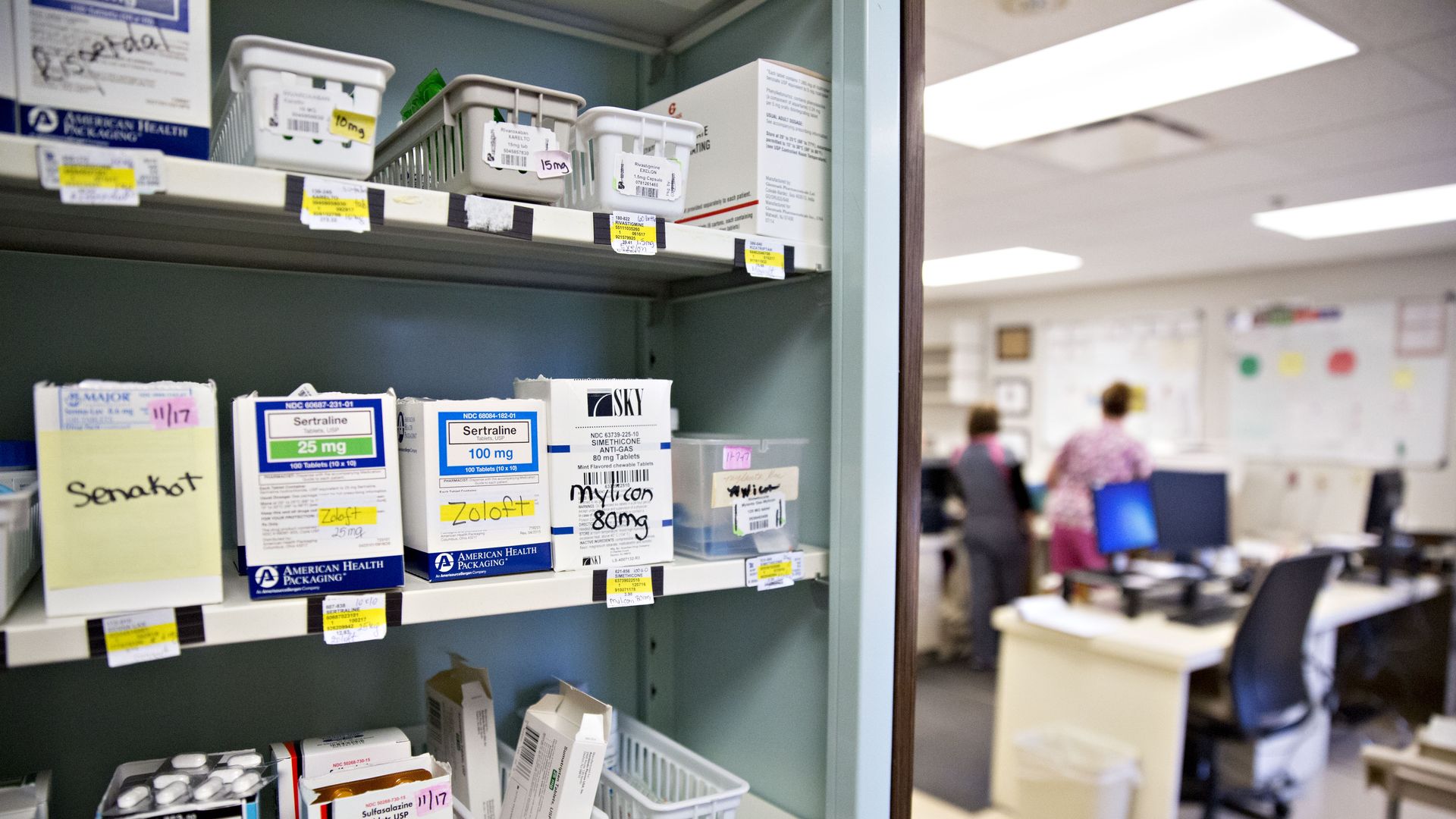 A shelf full of prescription medicines in a hospital.