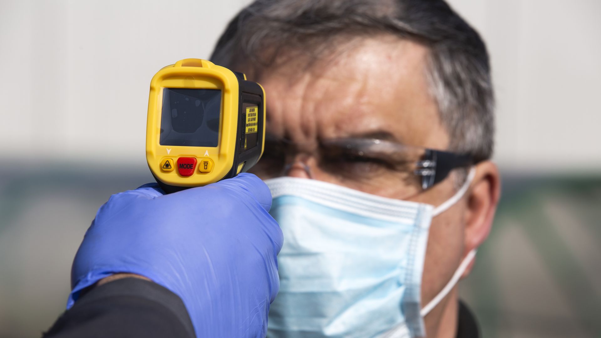 Worker getting temperature read
