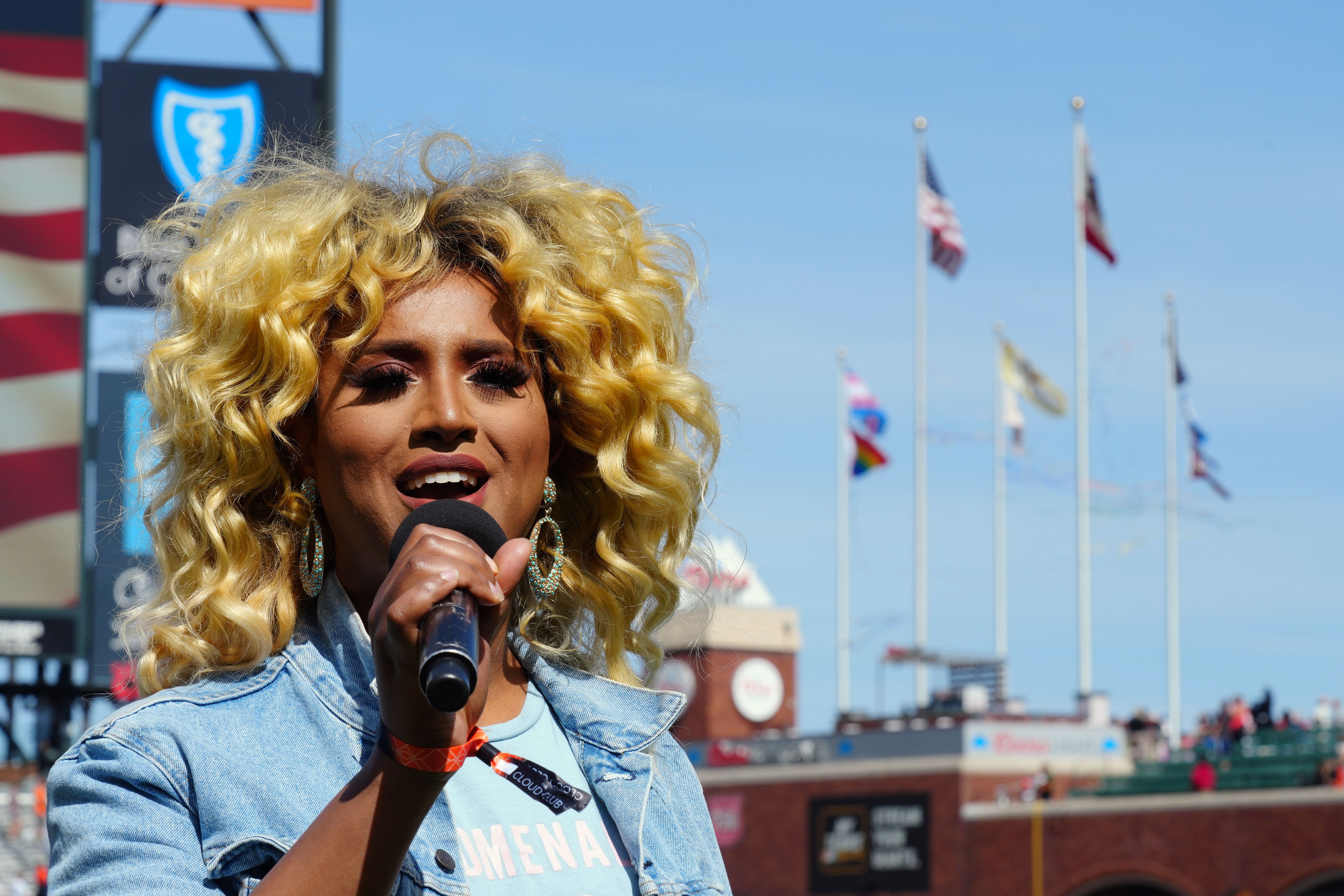 Honey Mahogany sings the national anthem.