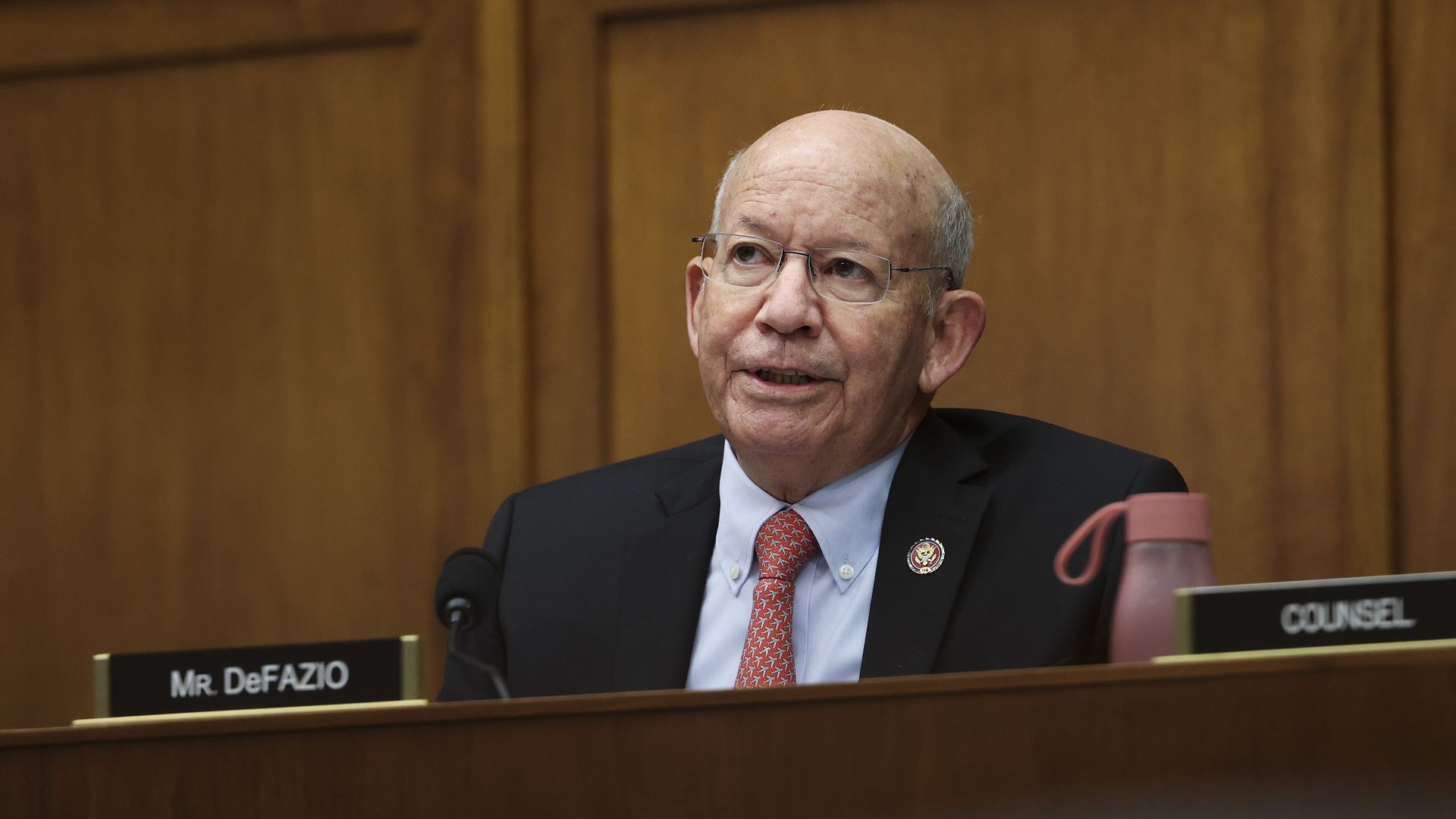 Photo of Peter DeFazio speaking while sitting in a chamber