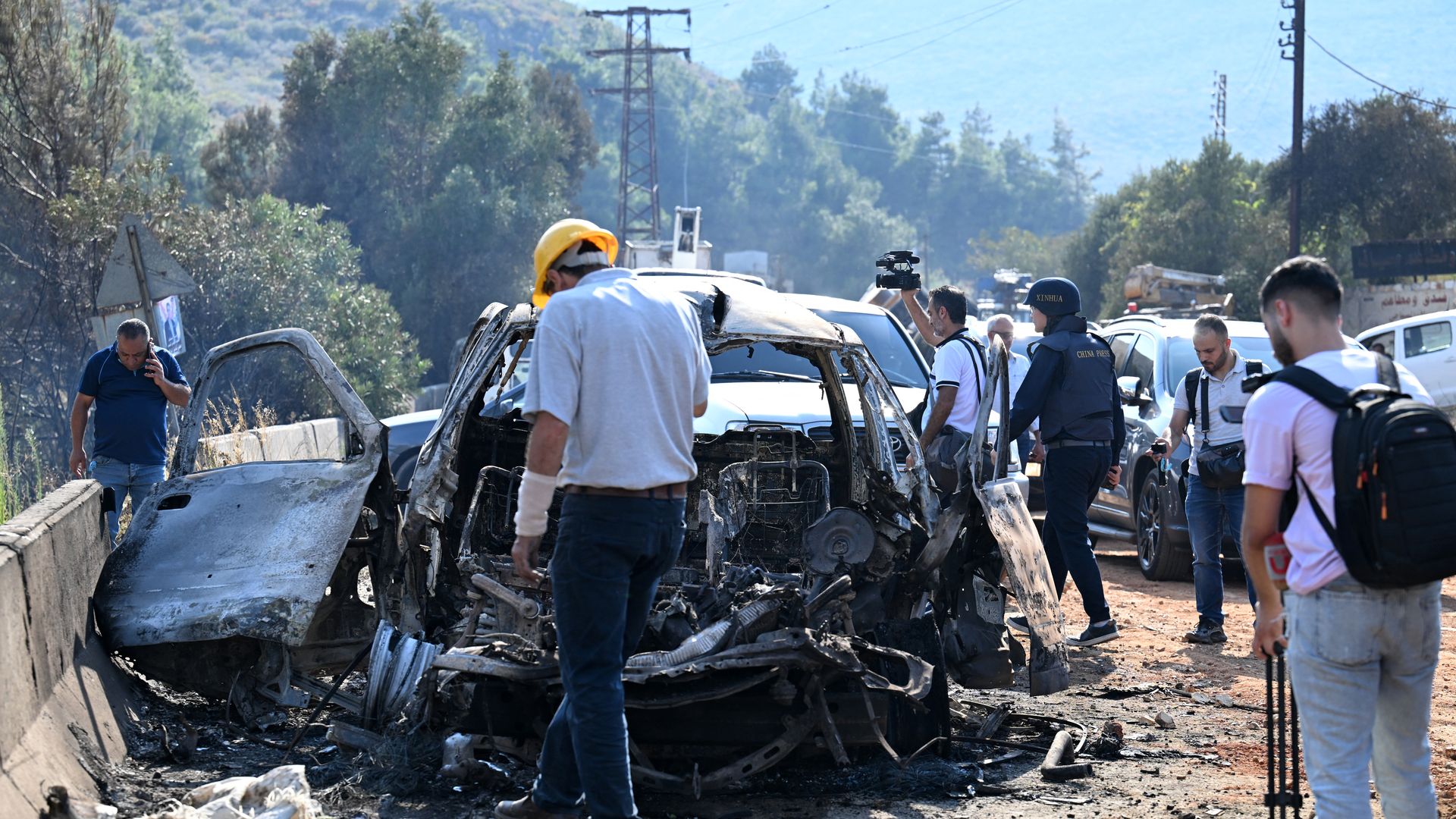 Syrians inspect the damage at the site of overnight Israeli strikes on the outskirts of Masyaf in Syria's central Hama province on September 9, 2024.