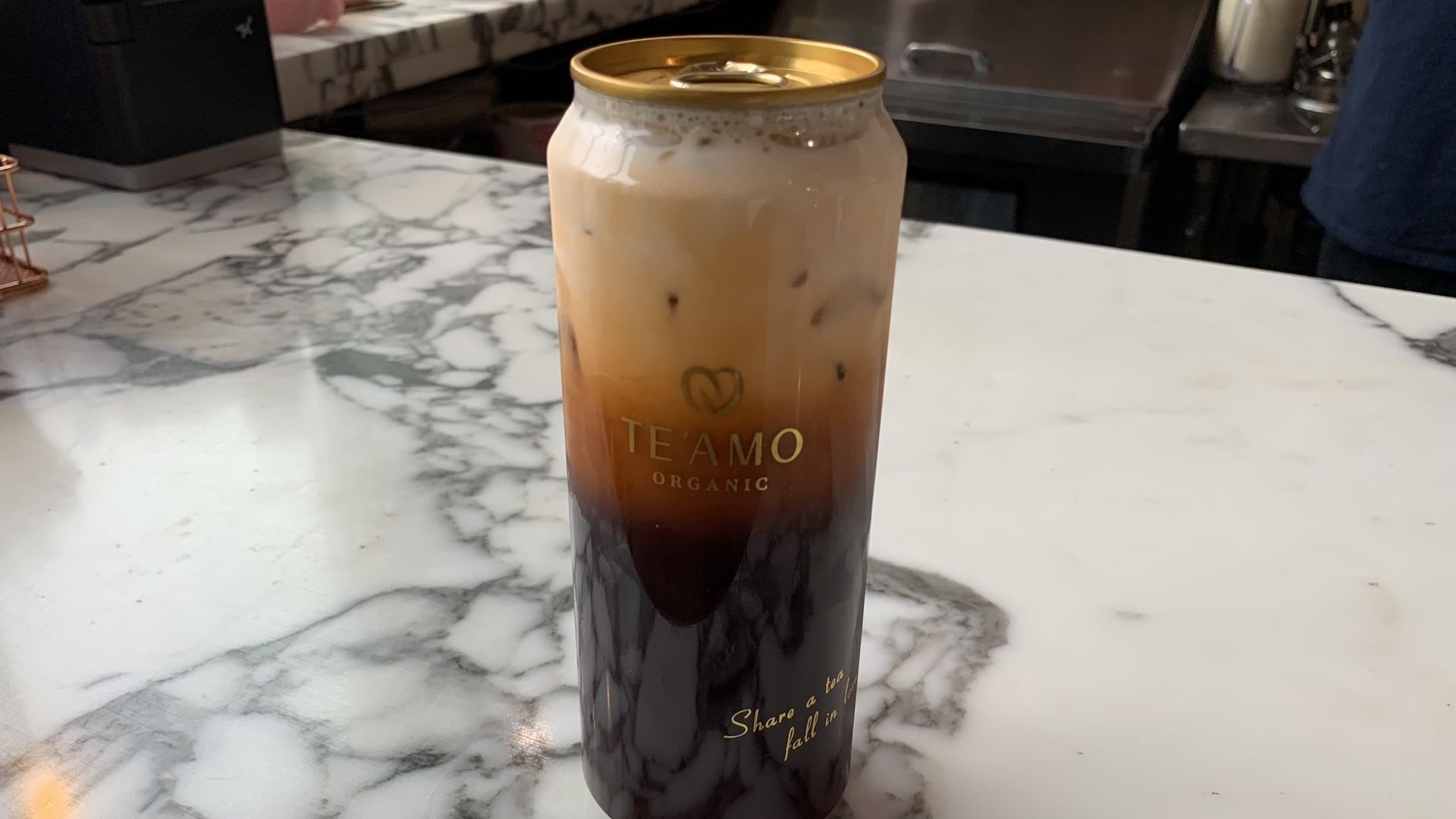 Photo of a bottle of iced tea on a counter. 