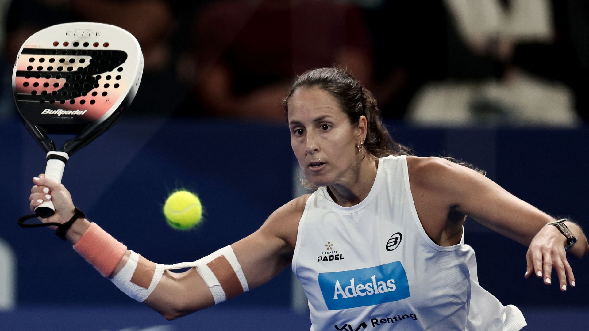 A woman playing padel.