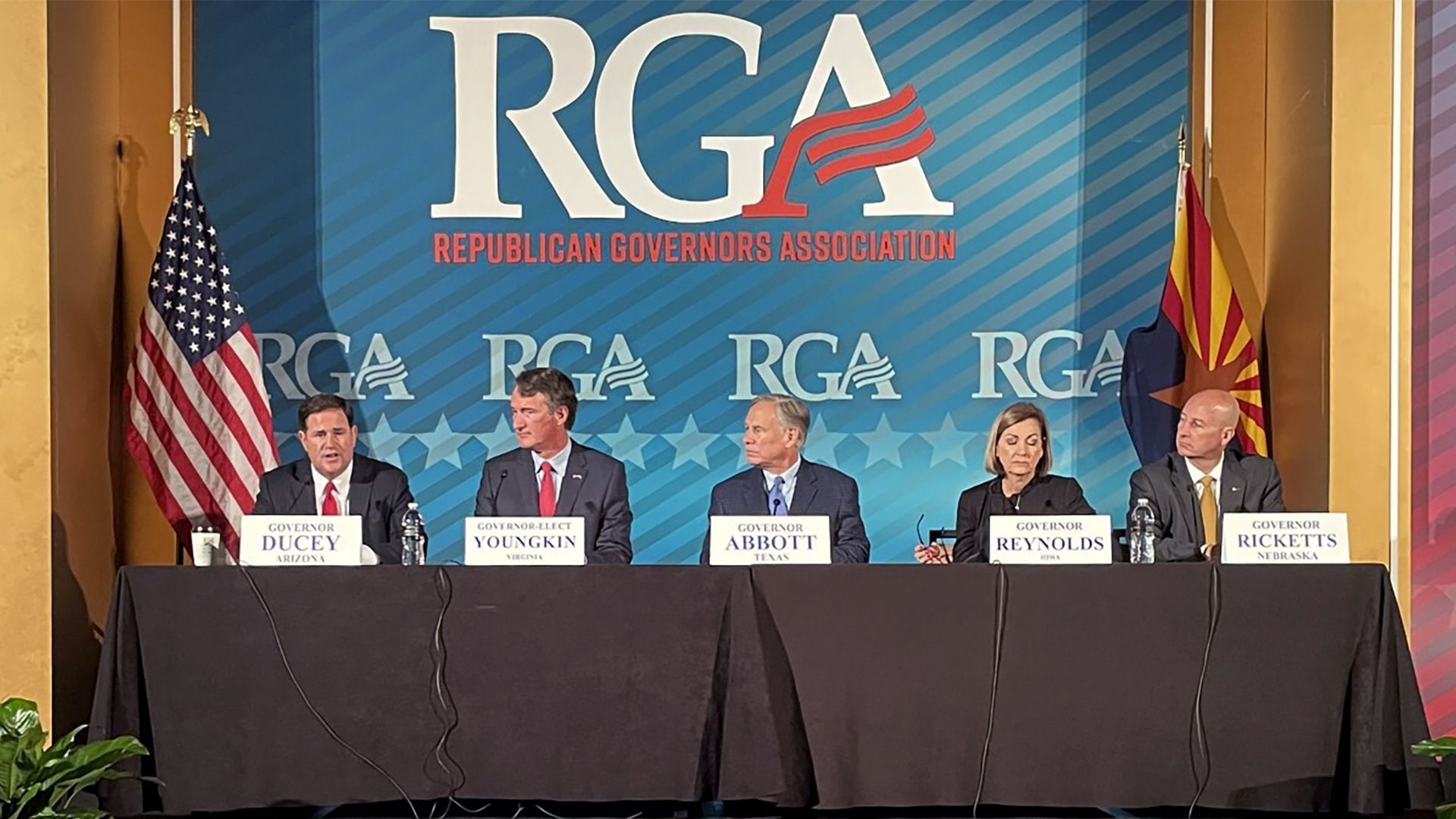 From left: Arizona Gov. Doug Ducey, Virginia Gov.-elect Glen Youngkin, Texas Gov. Greg Abbott, Iowa Gov. Kim Reynolds and Nebraska Gov. Pete Ricketts speak yesterday in Phoenix