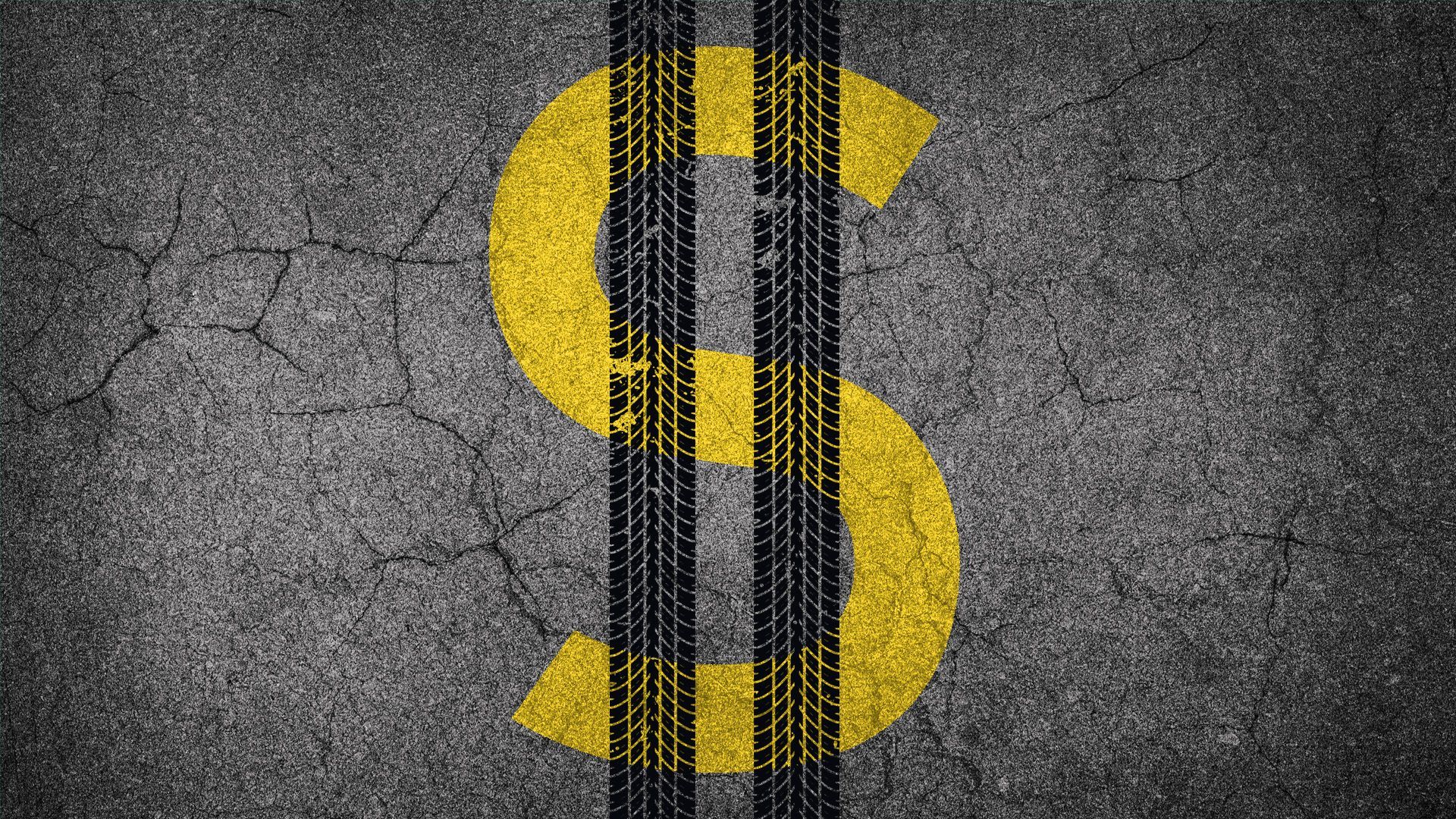 Illustration of a dollar sign made of tire tracks and street paint on a street