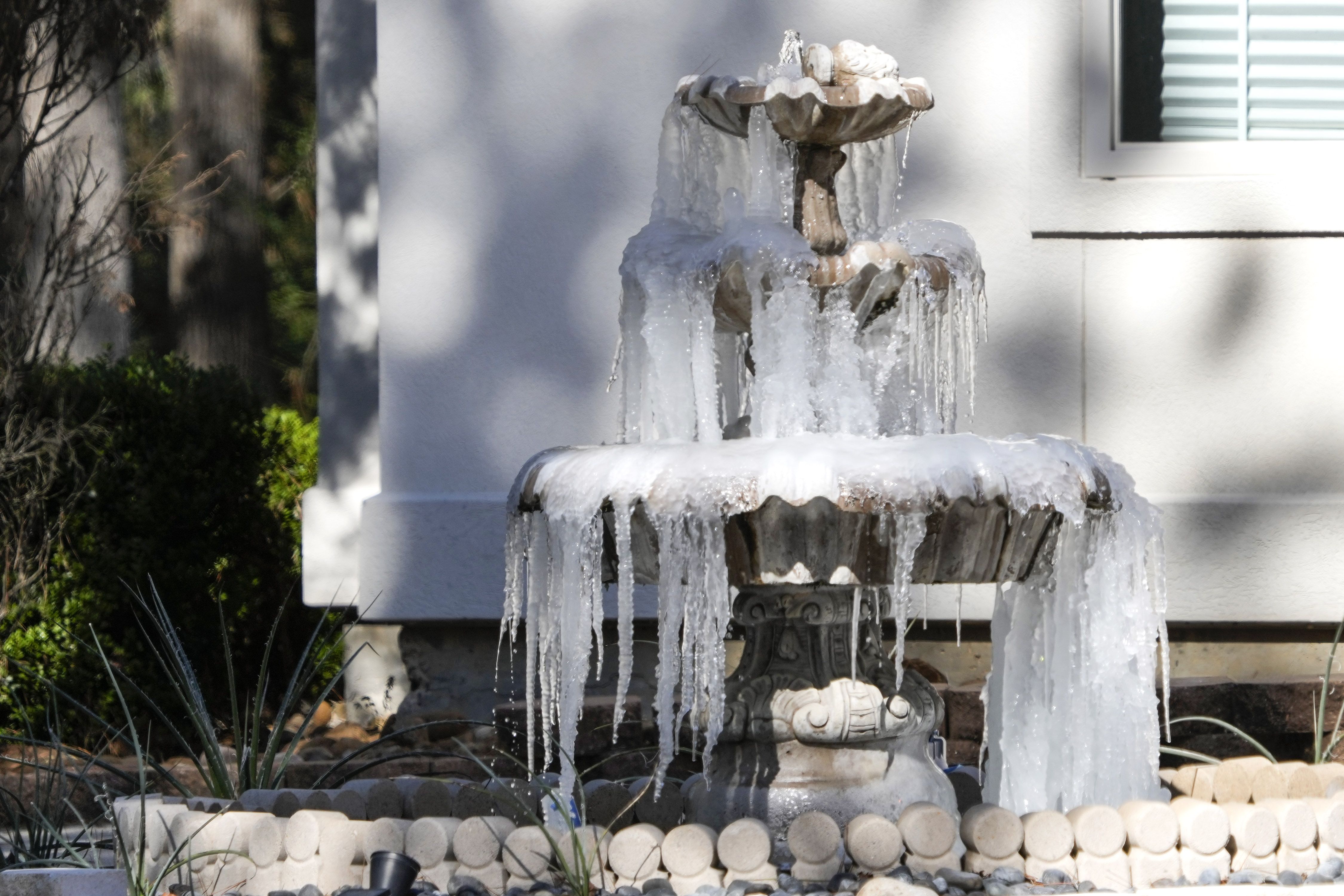  Ice is formed on a fountain in the High Meadow Ranch area on Tuesday, Jan. 16, 2024 in Magnolia. The Magnolia neighborhood has experience a limited natural gas supply during this week's freeze, as the homeowner's association reports a damaged gas pipe caused pressure issues, according to an HOA email provided to the Chronicle. 