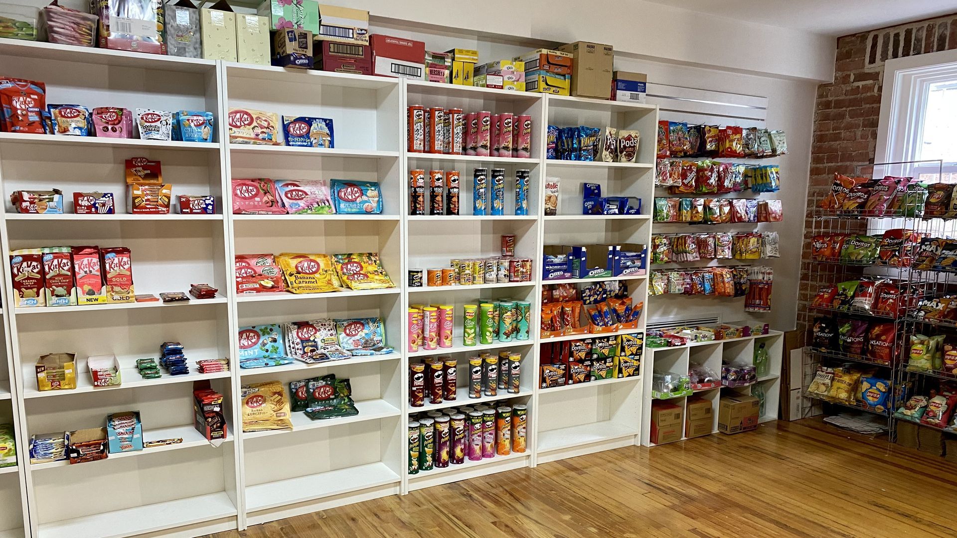 Shelves full of snacks at It's A Bodega