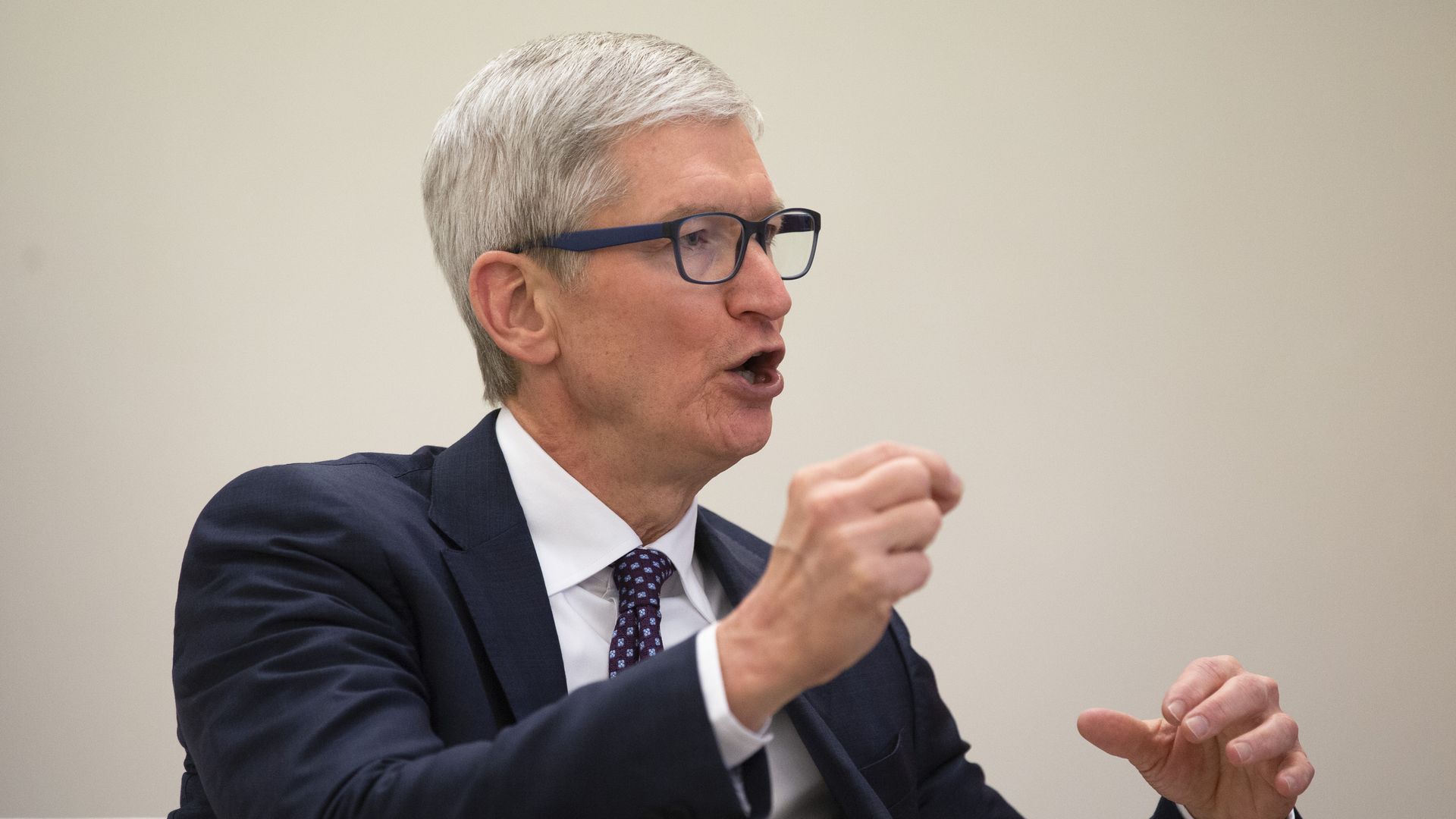 Tim Cook gesticulates during a speech.